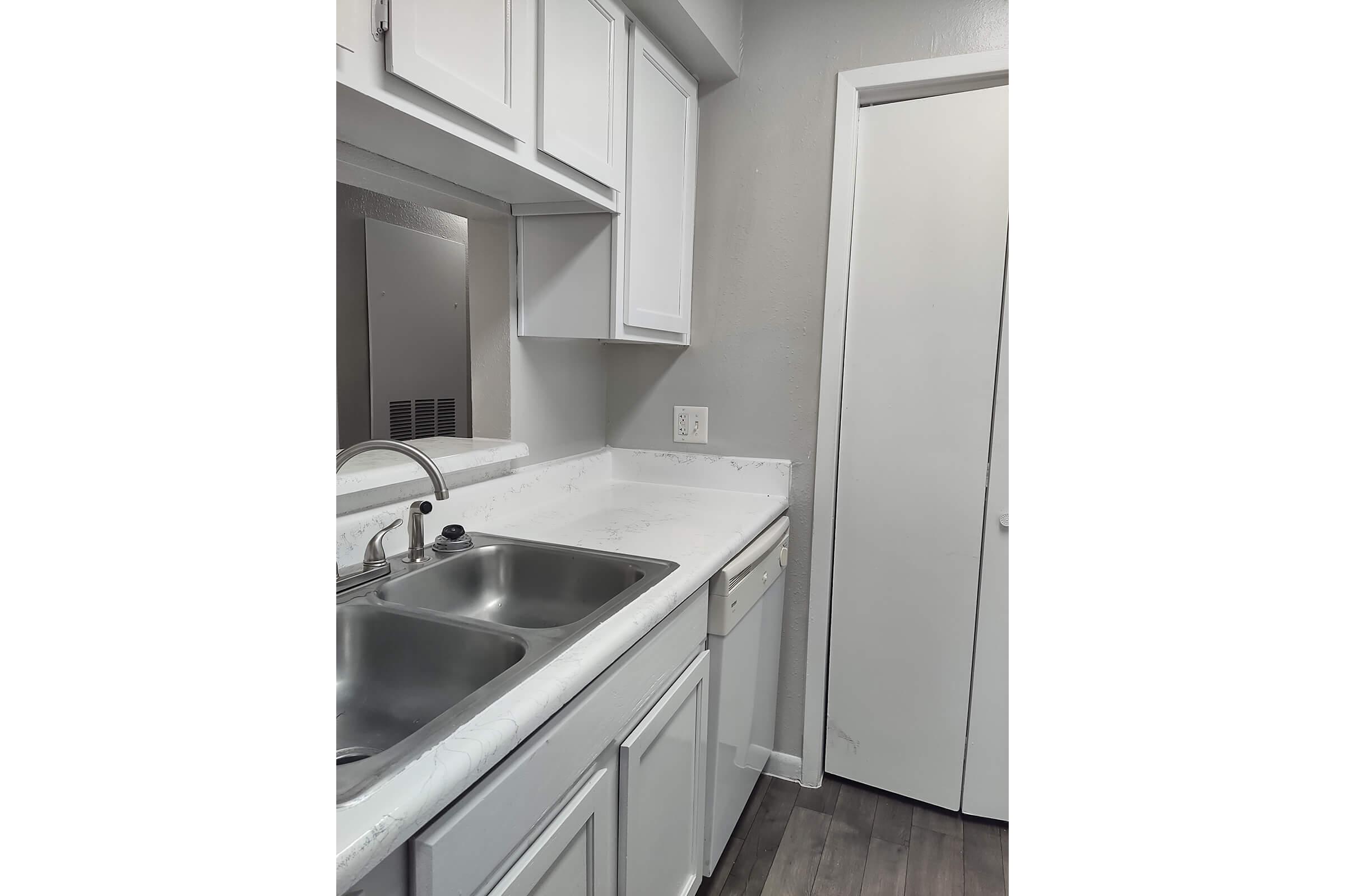 a kitchen with a stove and a sink