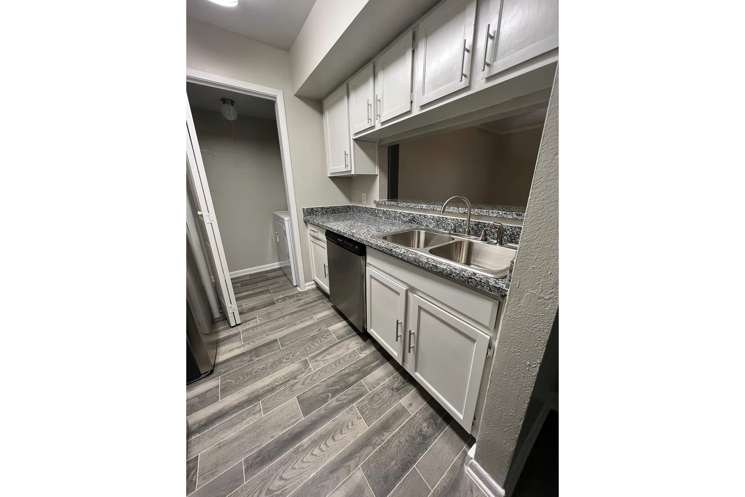 a kitchen with a building in the background