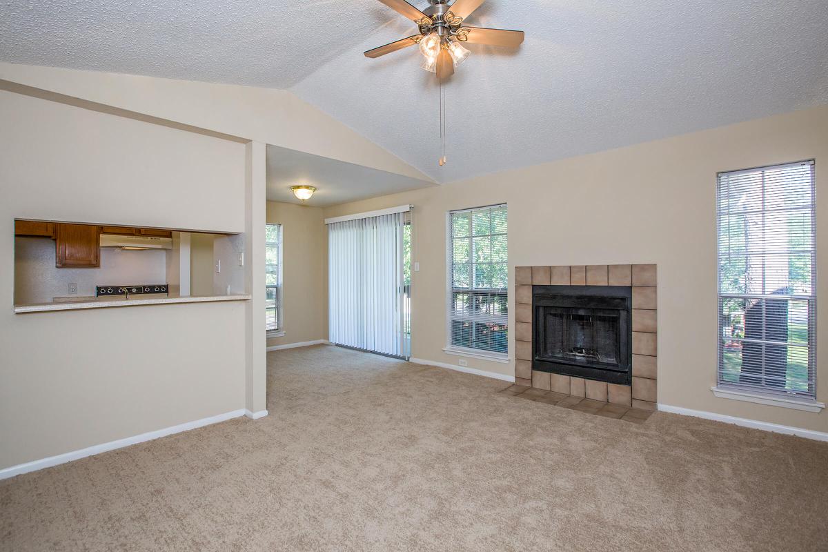 a living room filled with furniture and a flat screen tv