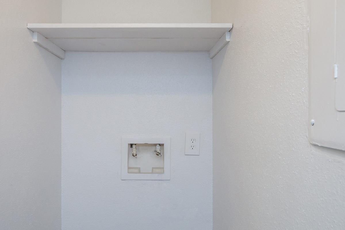 a white refrigerator freezer sitting next to a door