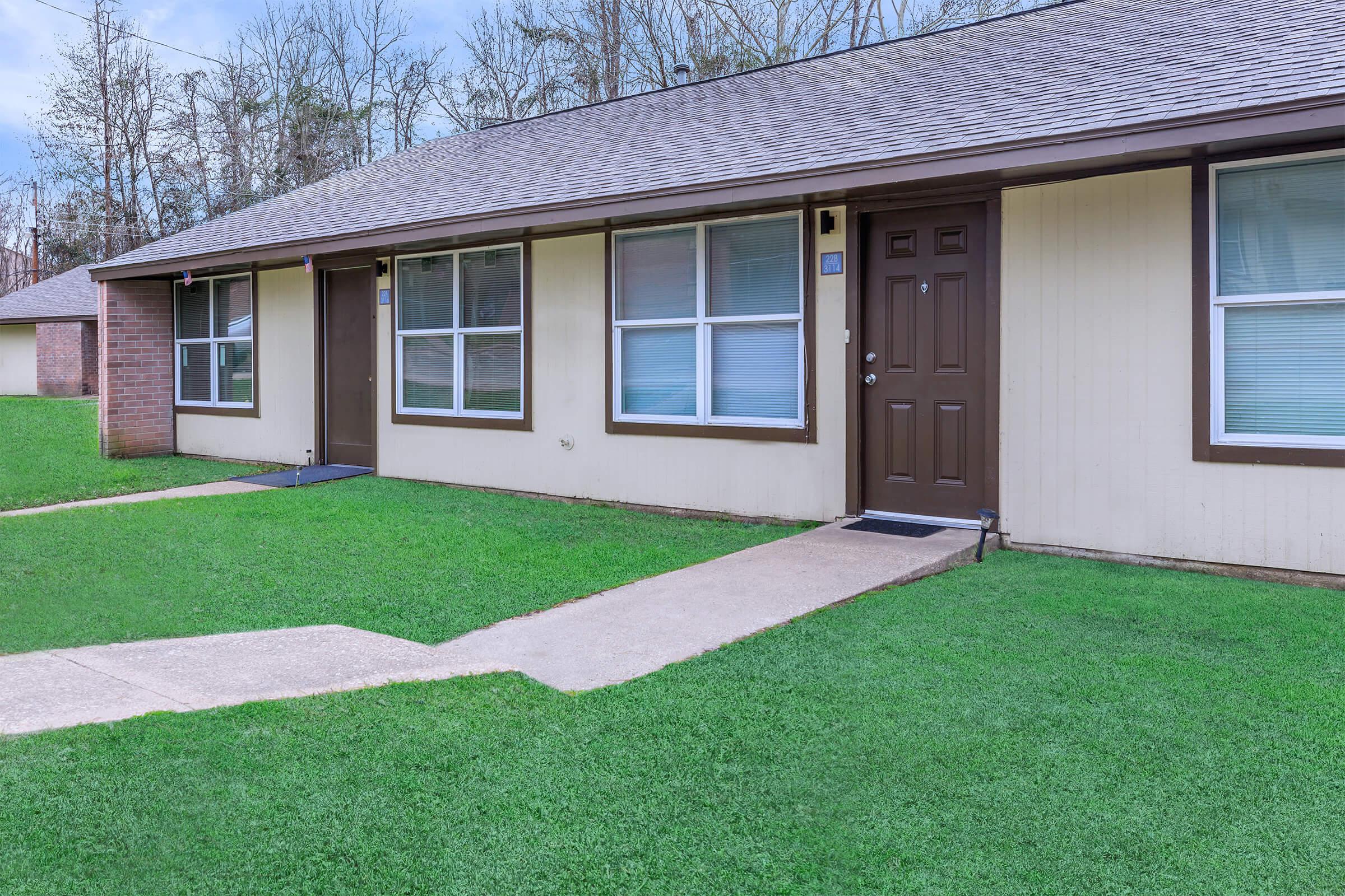 a large lawn in front of a house