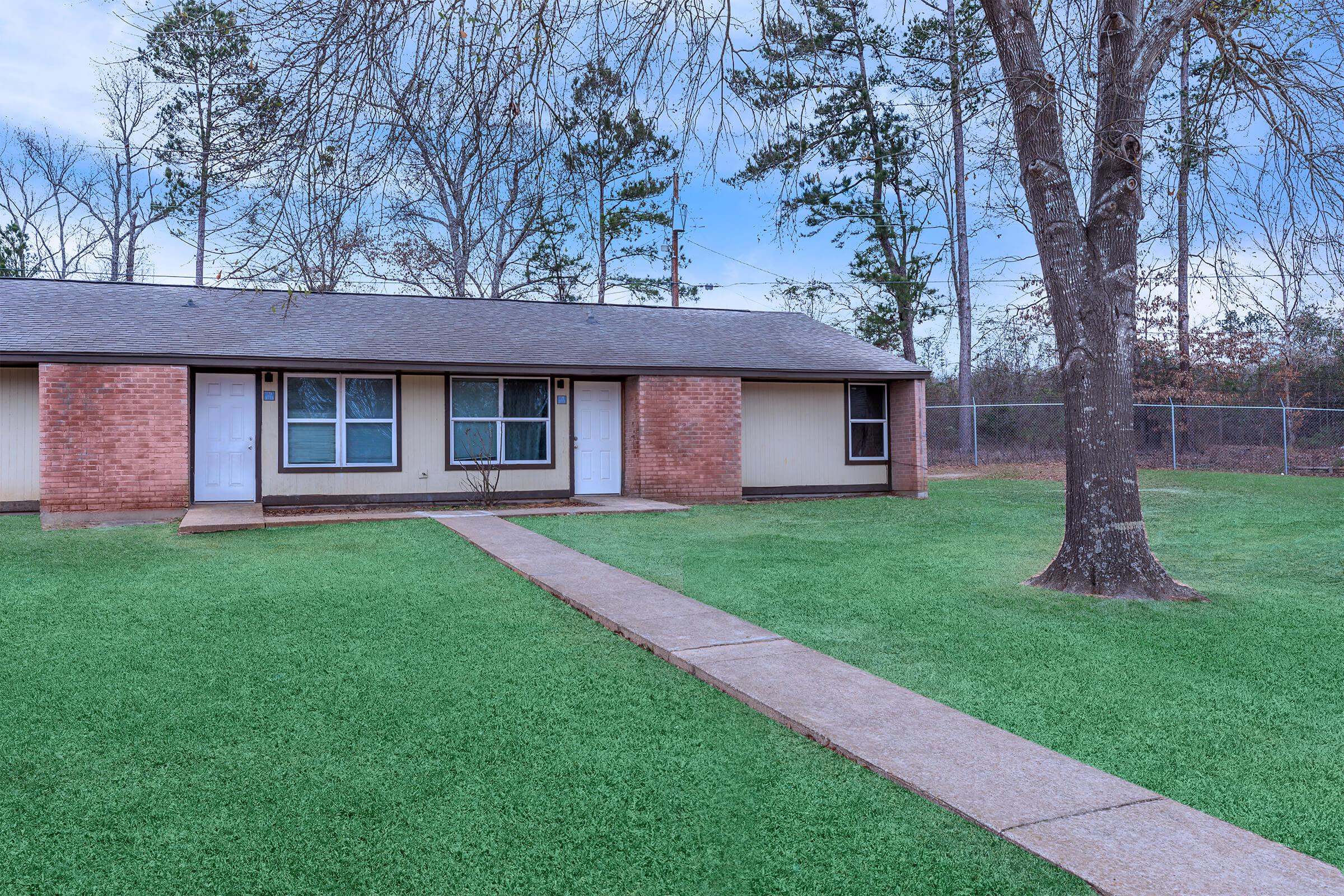 a large lawn in front of a house