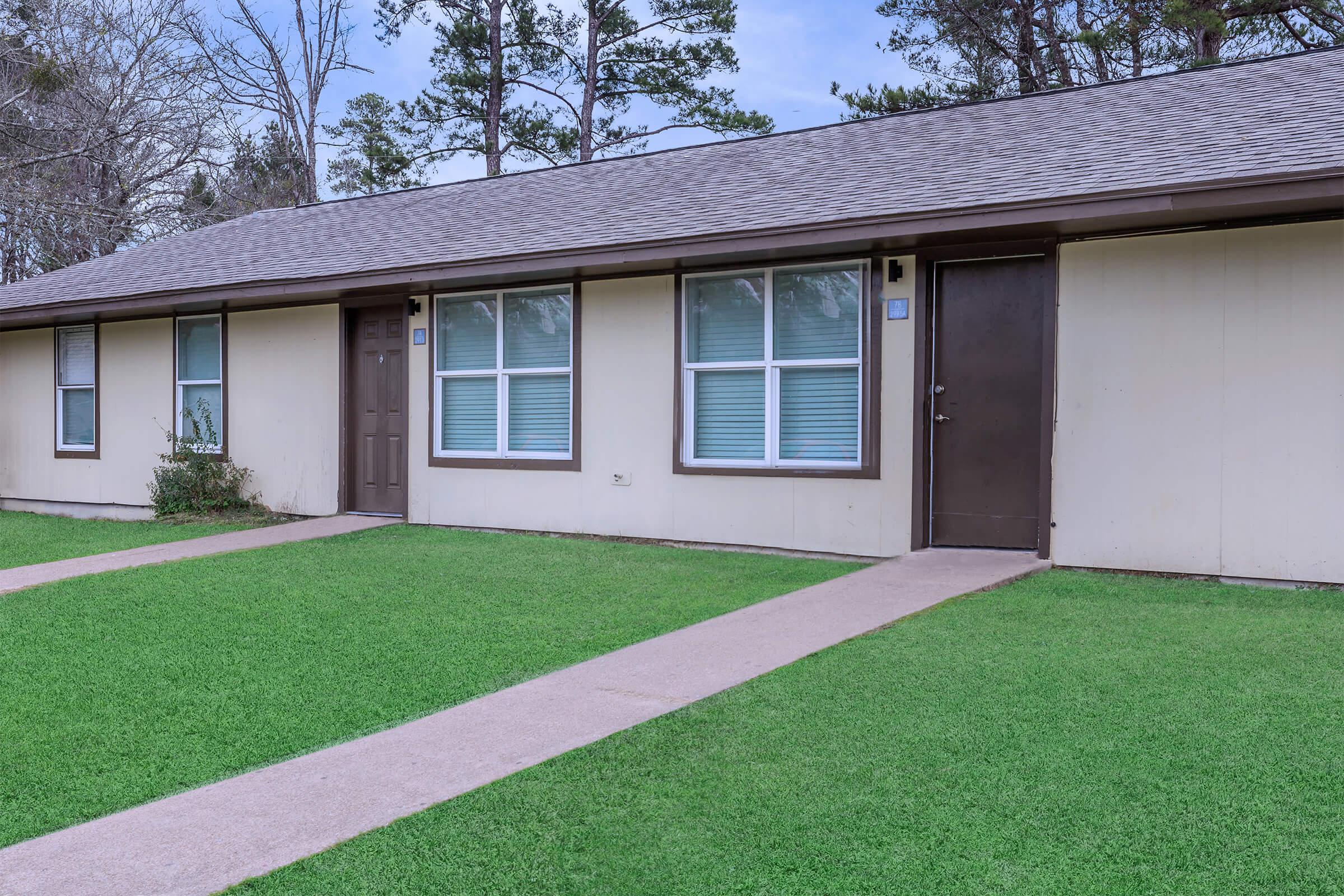 a large lawn in front of a house