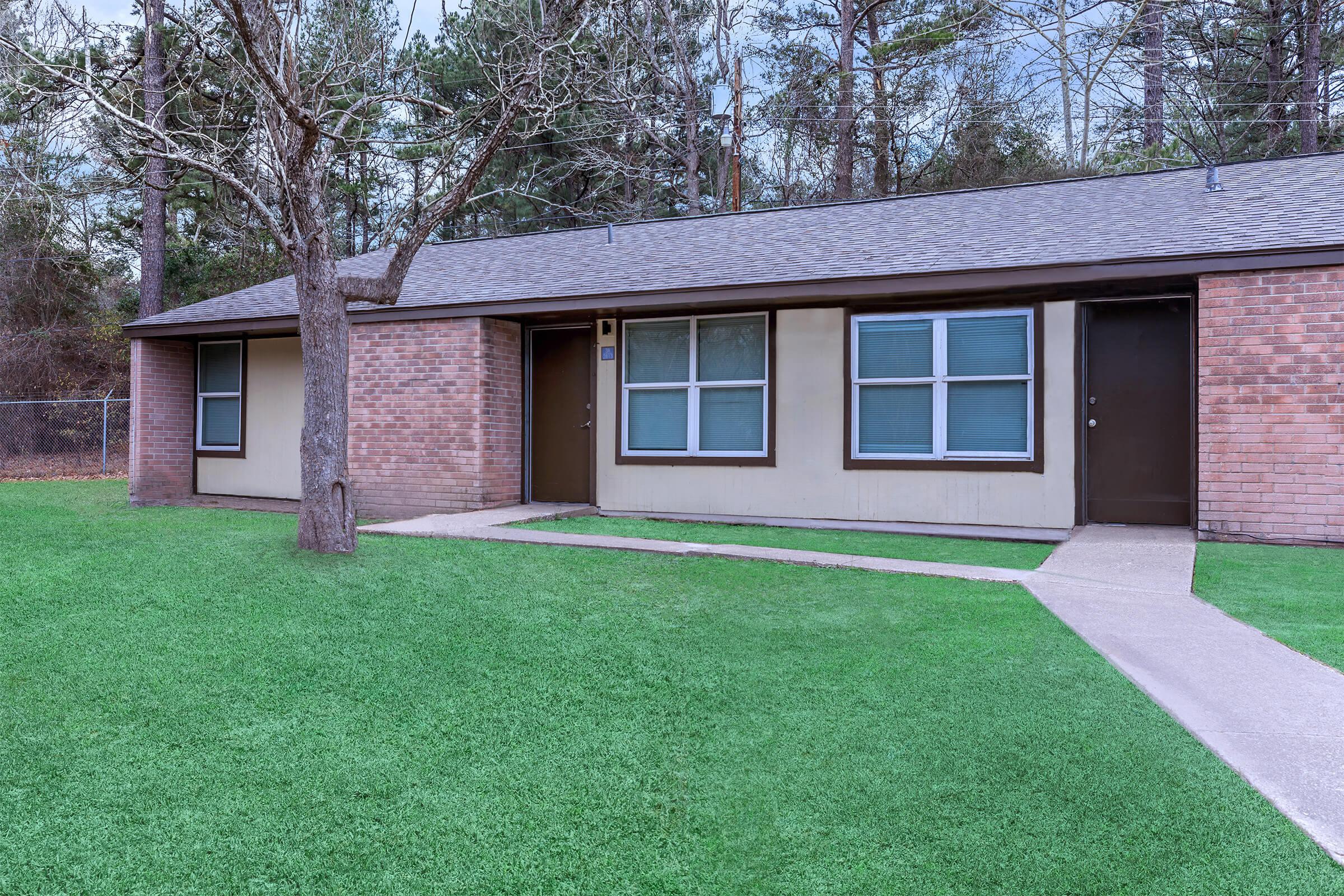 a large lawn in front of a house