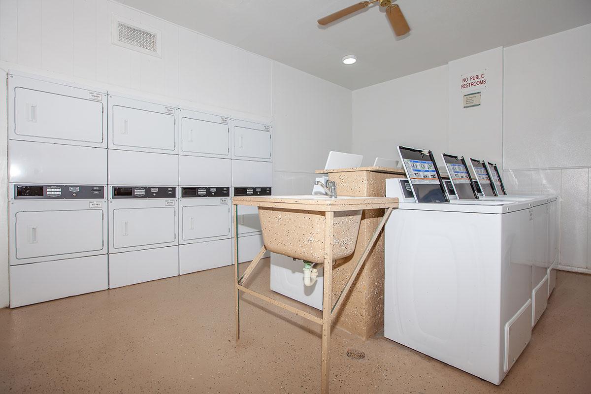 a white refrigerator freezer sitting inside of a kitchen