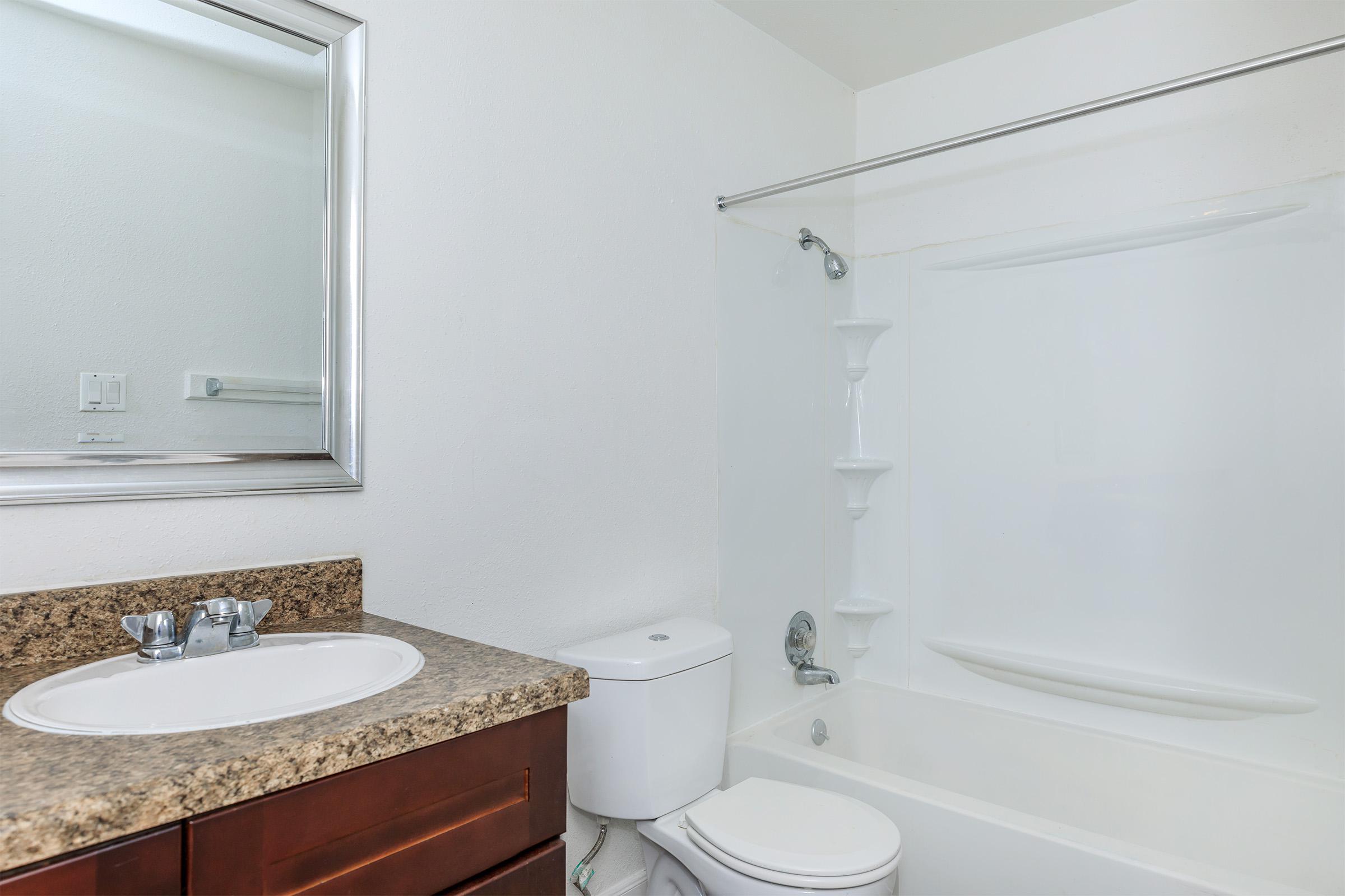 a room with a sink and a mirror