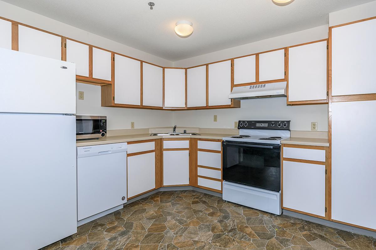 a large white refrigerator in a kitchen