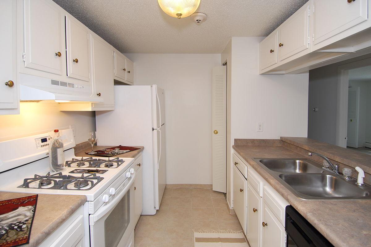 a kitchen with a stove top oven