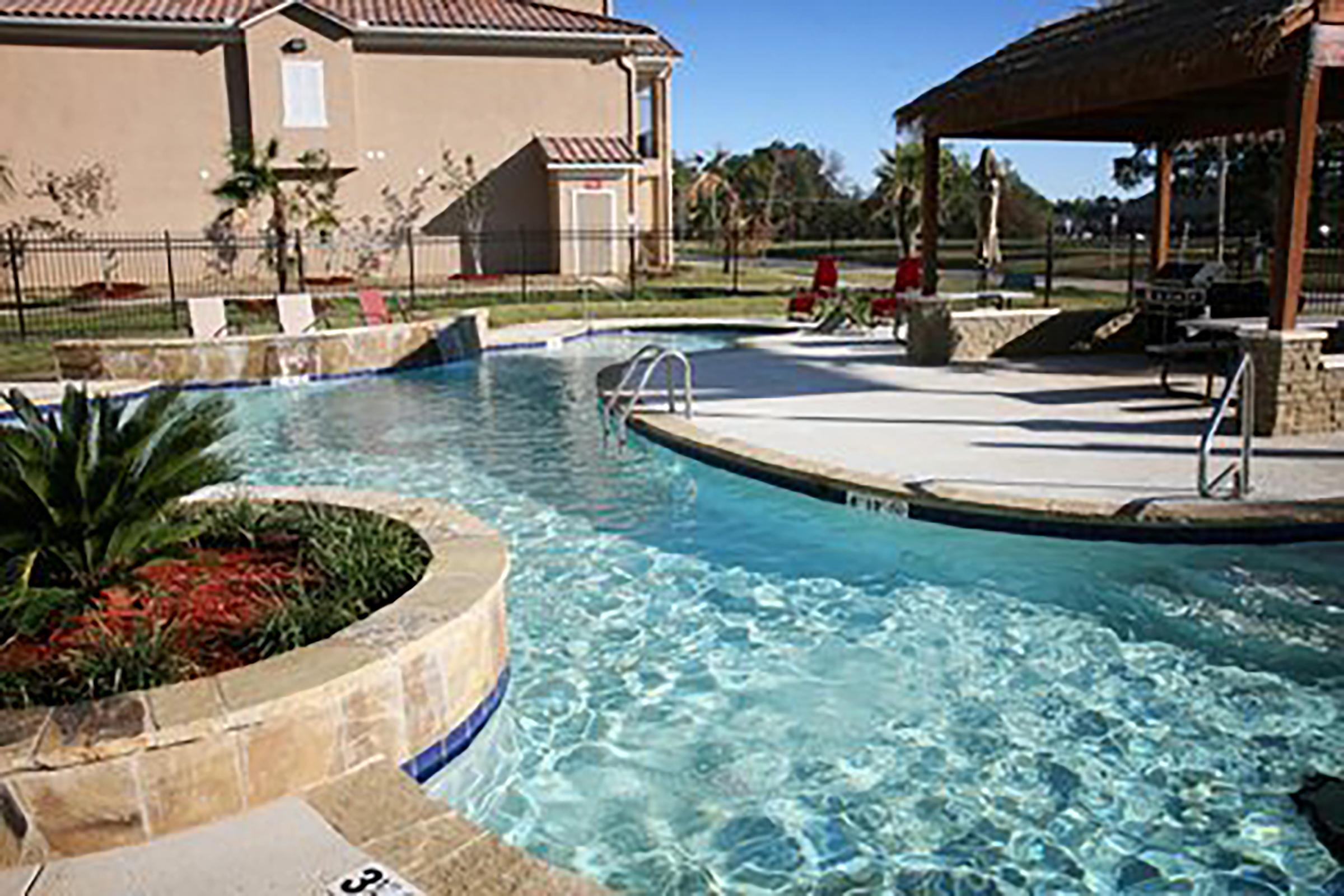 a house with a large pool of water