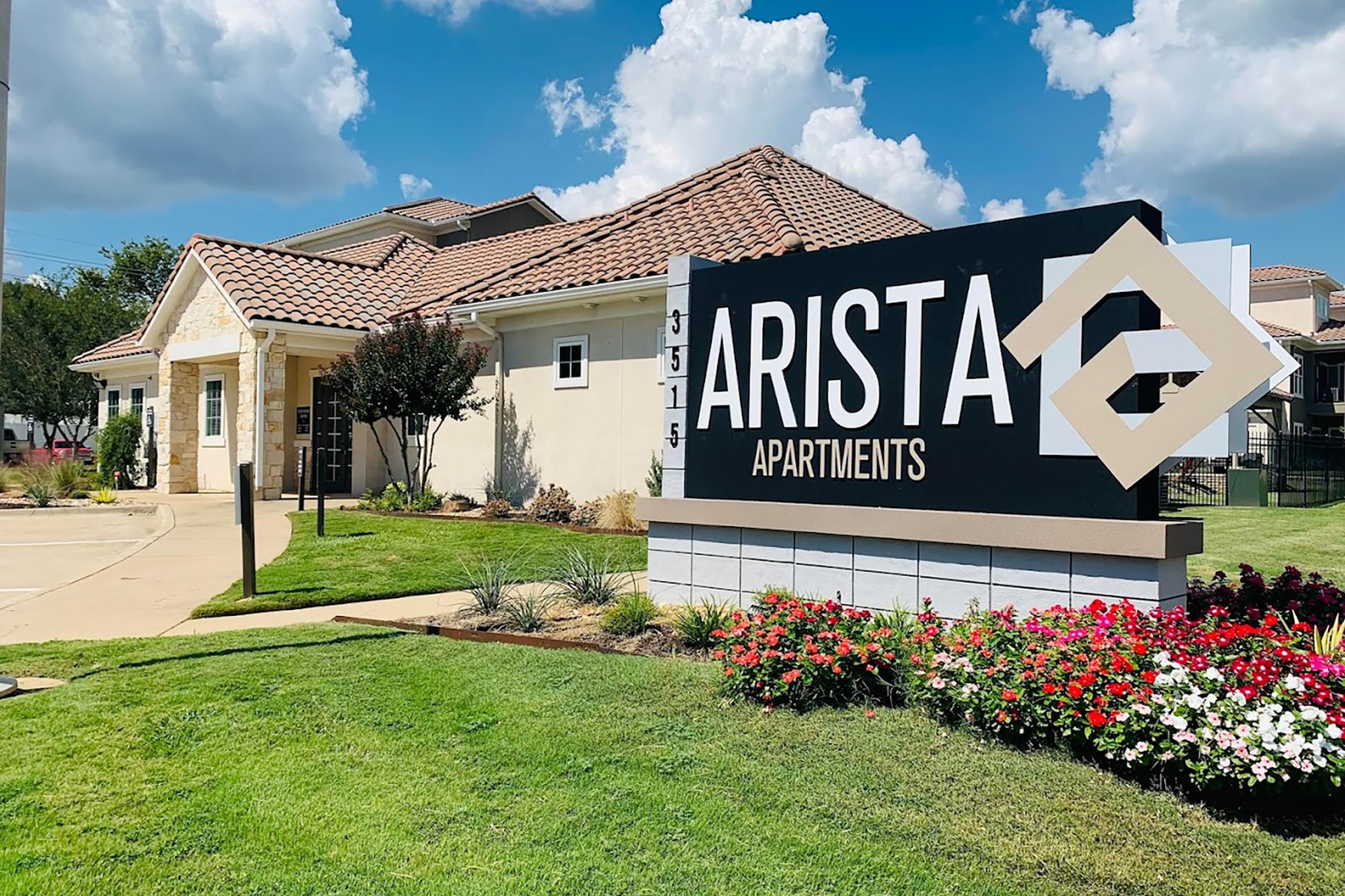 a sign in front of a house