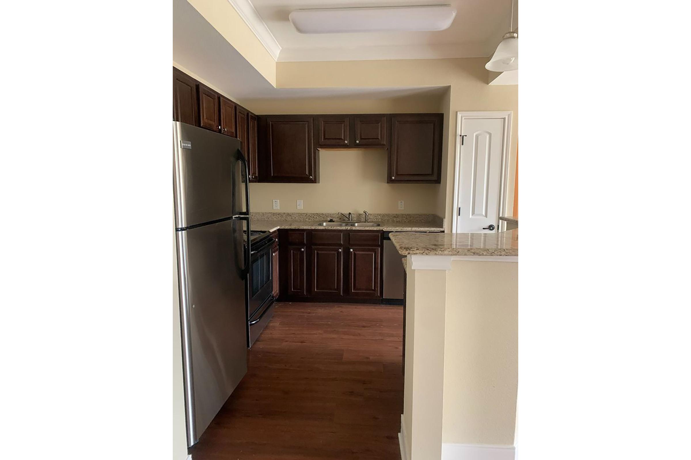 a kitchen with a wood floor