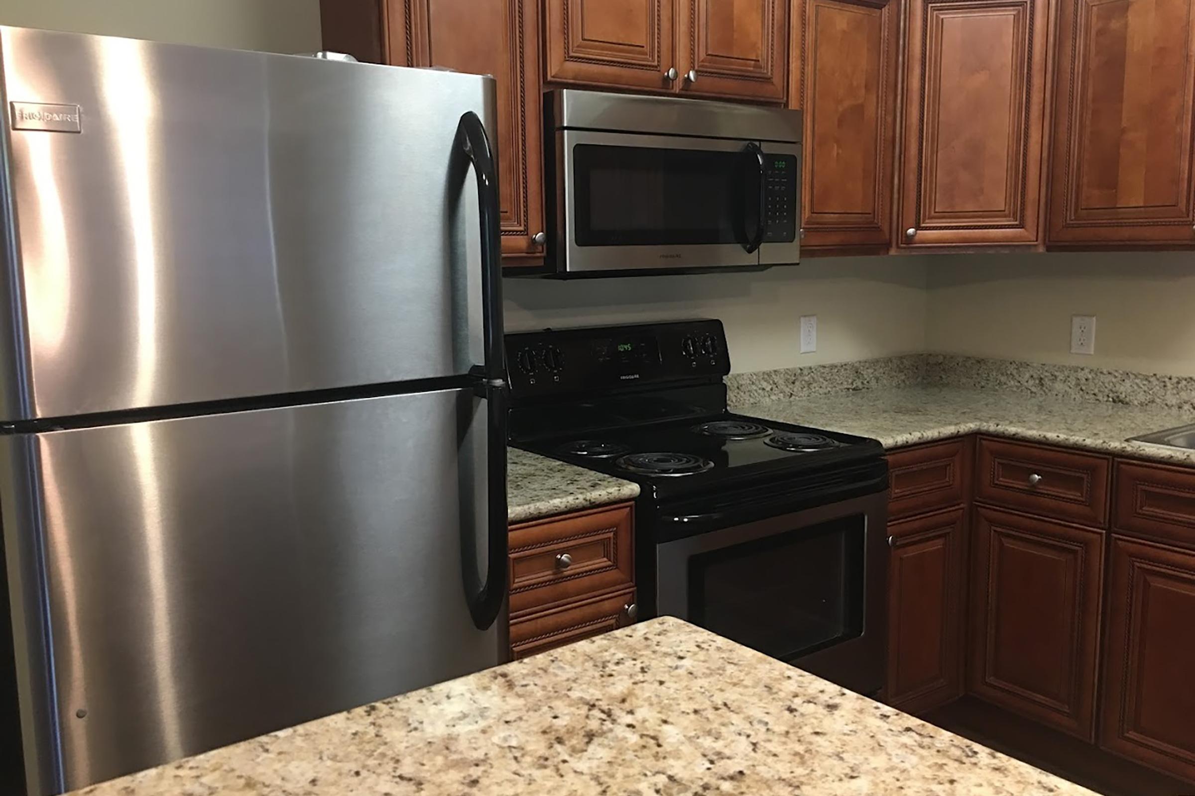 a stainless steel refrigerator in a kitchen