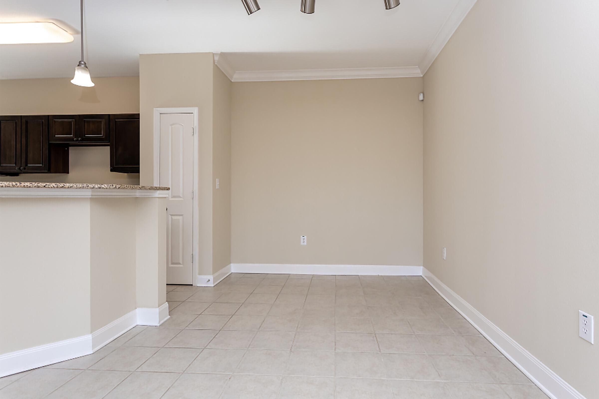 a kitchen with a tile floor