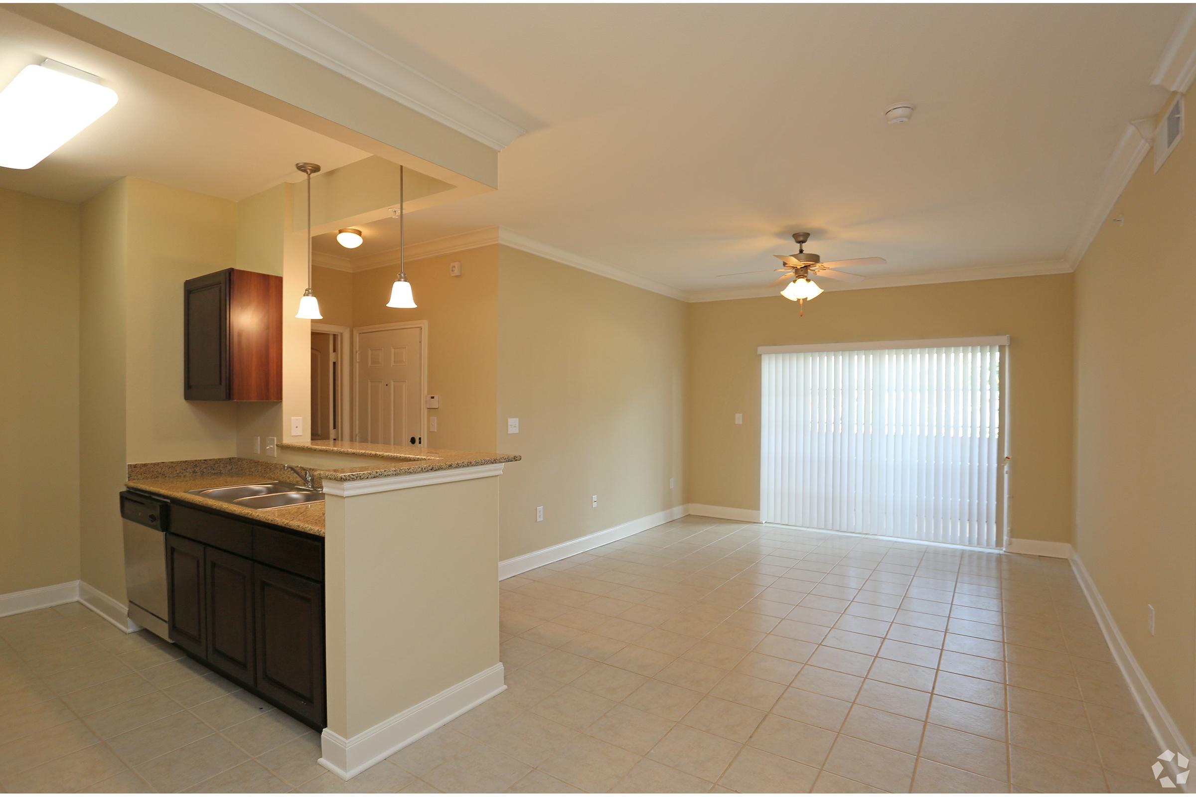 a kitchen with a tile floor