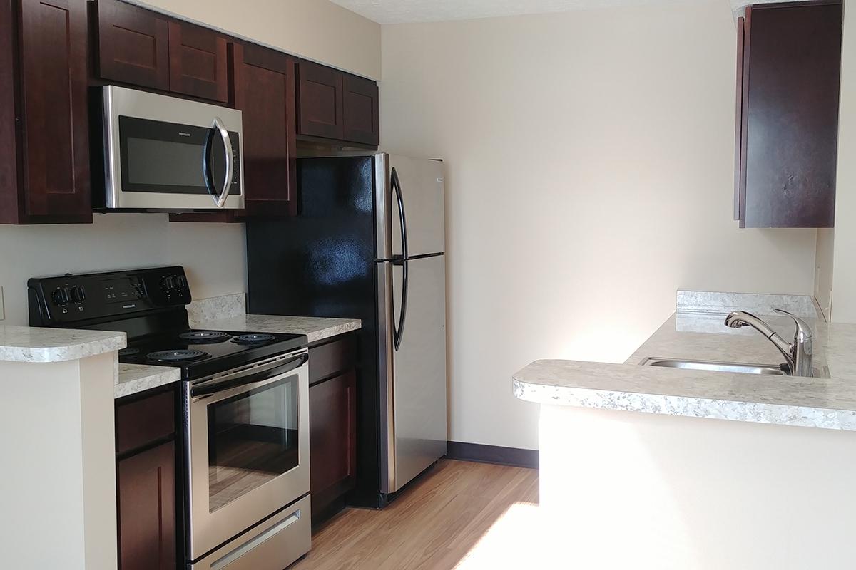 a modern kitchen with stainless steel appliances