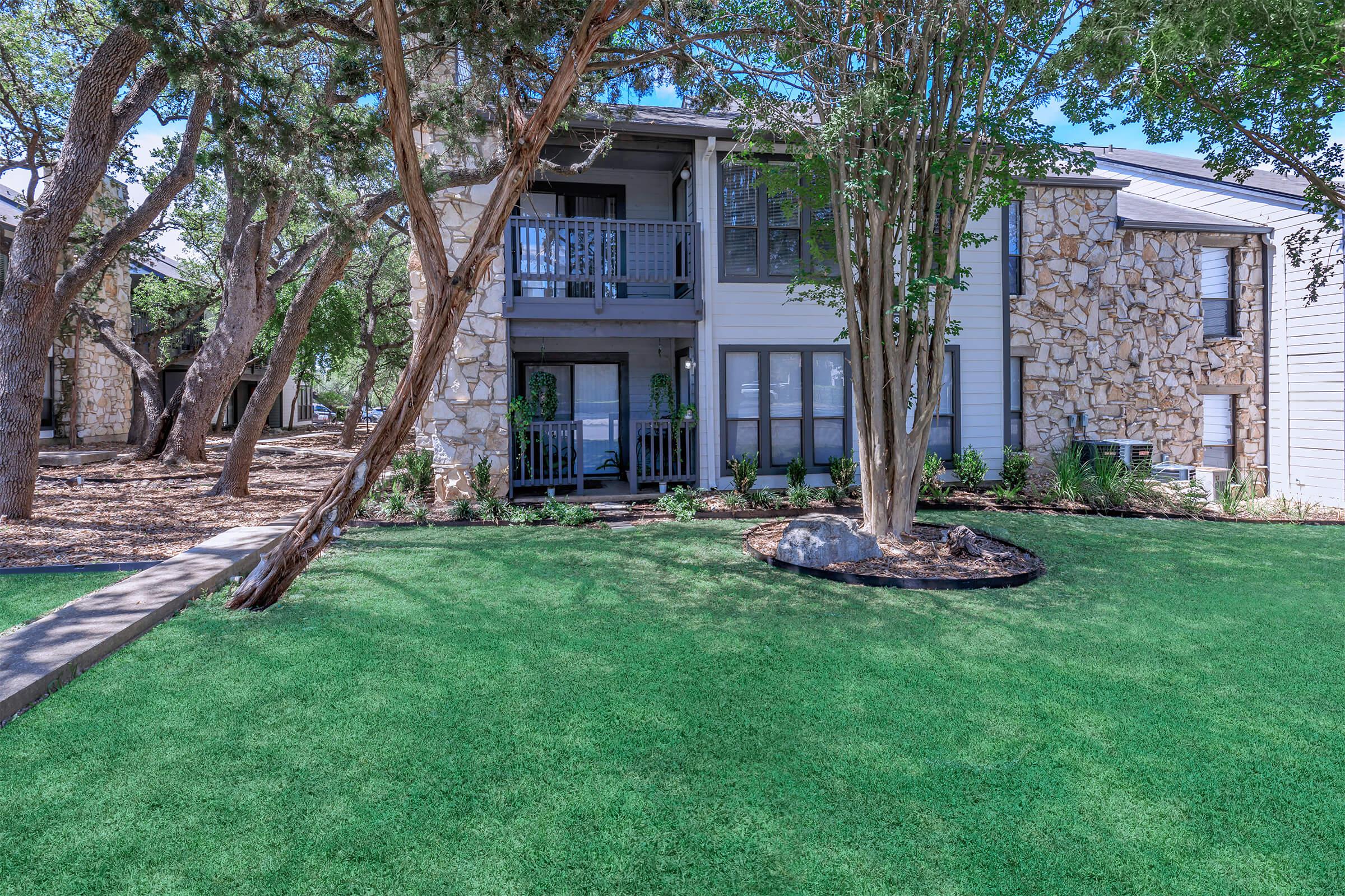 a large lawn in front of a house