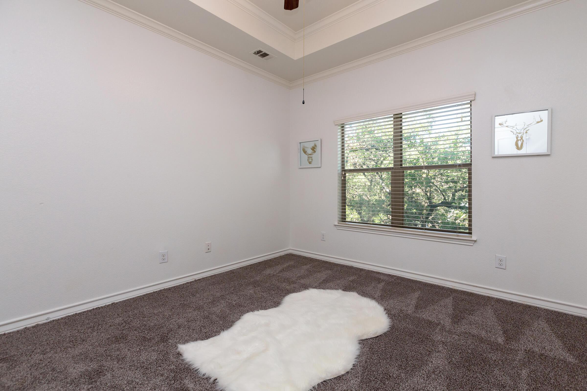 a bedroom with a large window