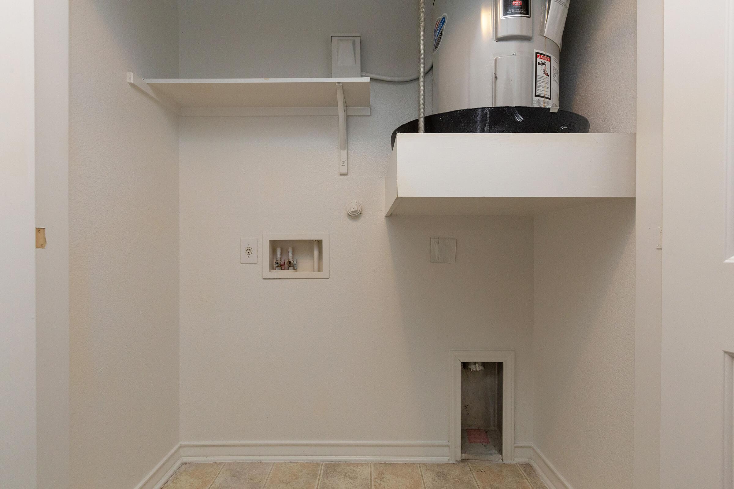 a white sink sitting under a mirror