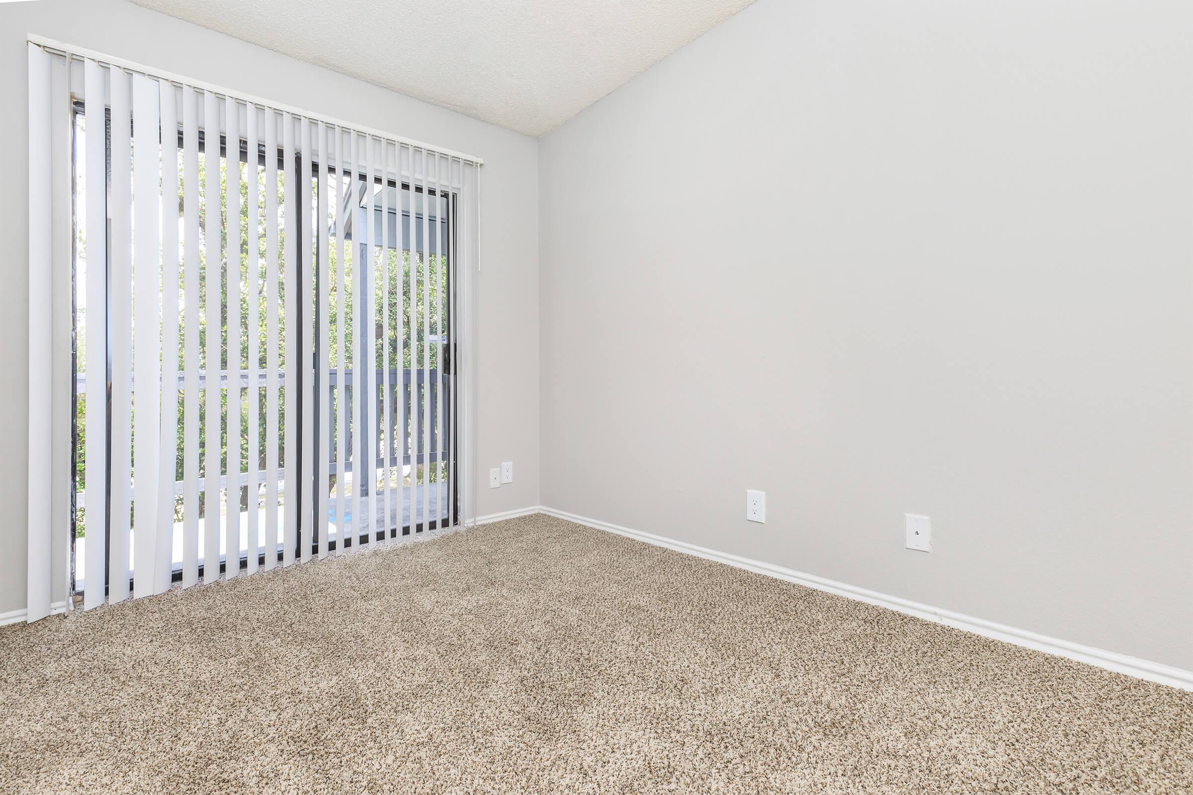 a bedroom with a bed and a mirror