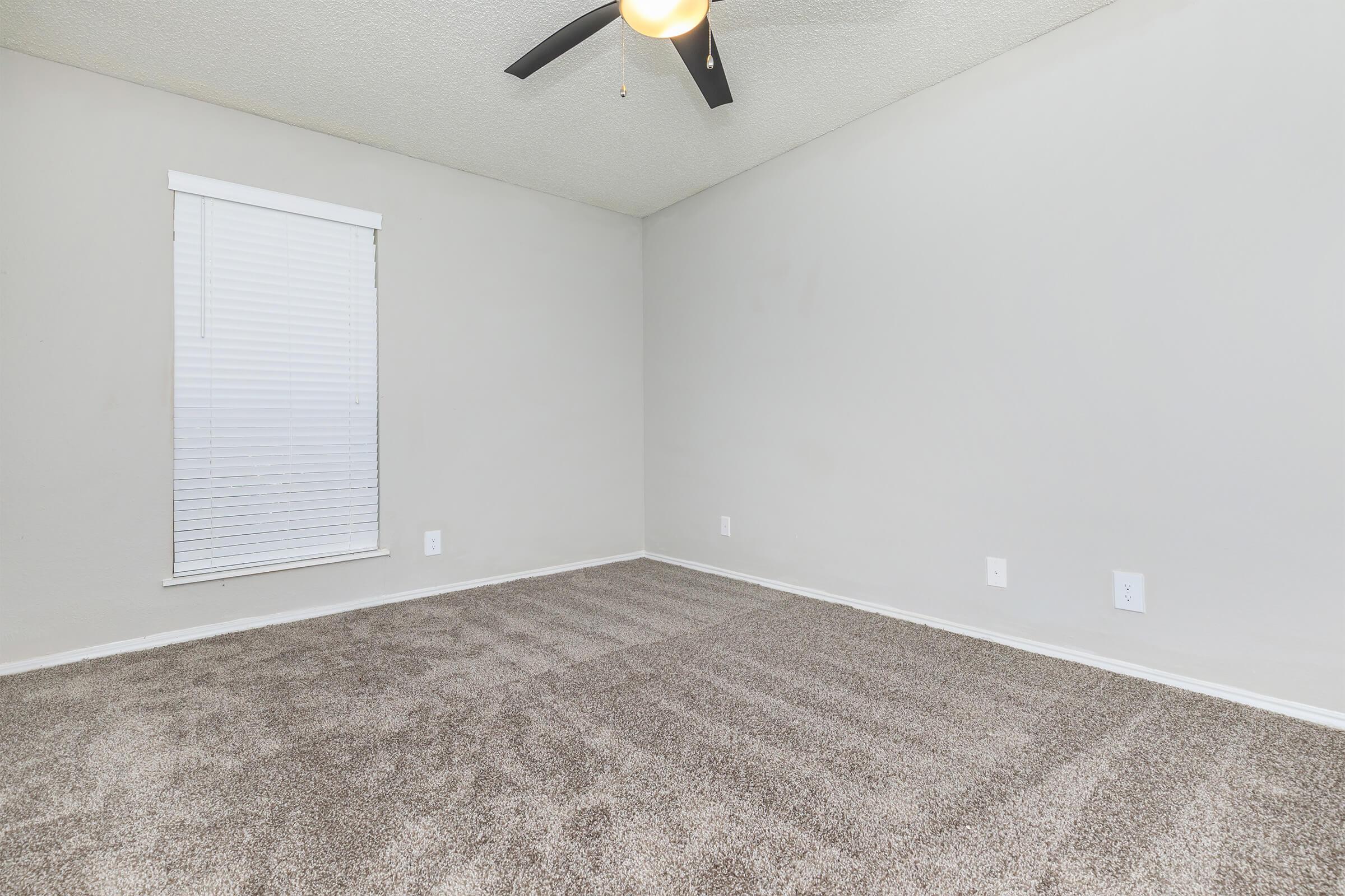 a bedroom with a large mirror