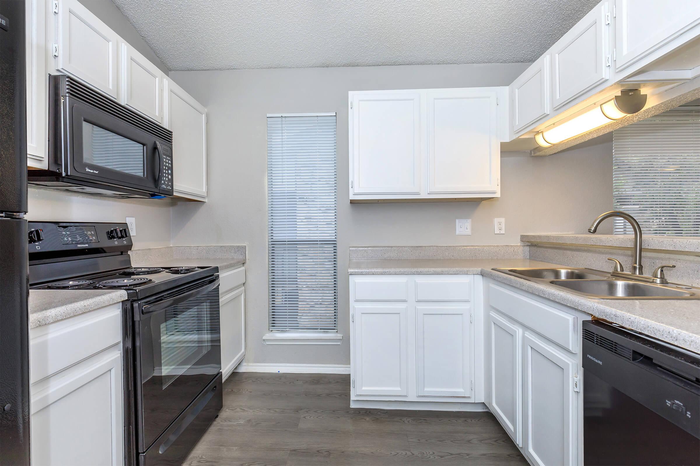 a kitchen with a stove top oven