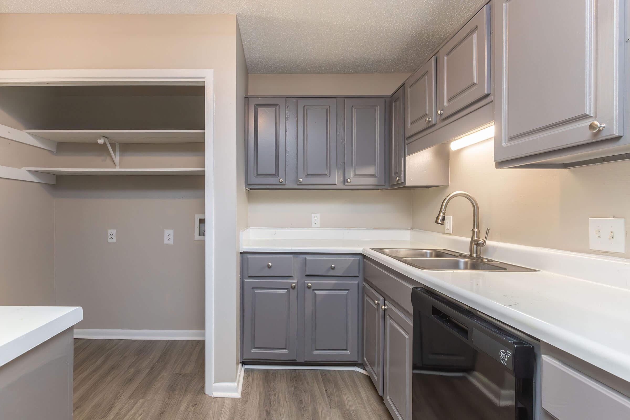 a kitchen with a sink and a microwave