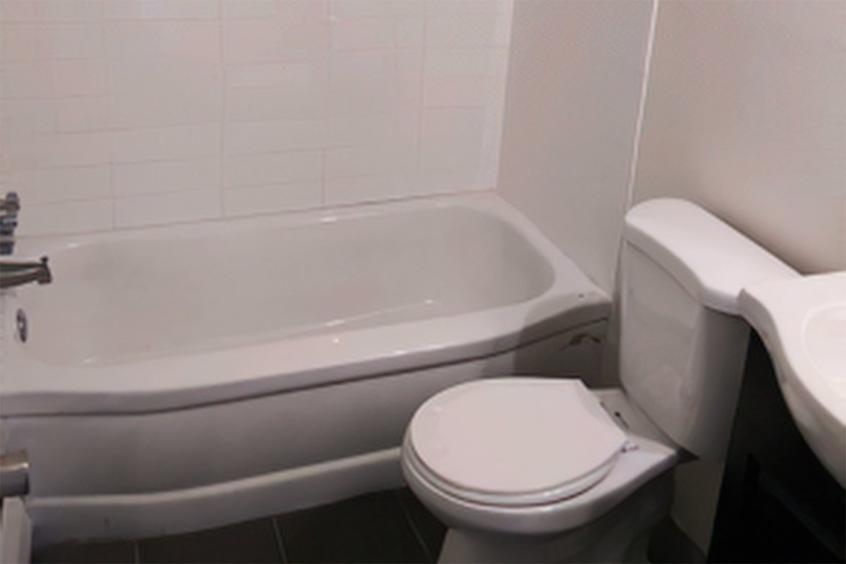 a close up of a sink and a bath tub