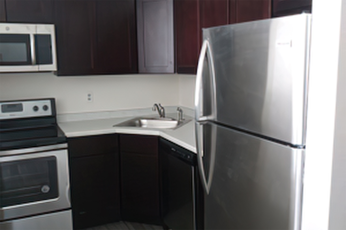 a kitchen with a stove top oven sitting inside of a refrigerator