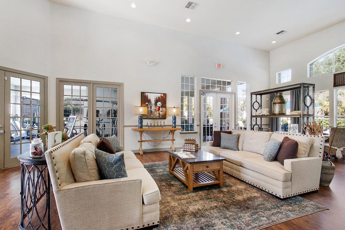 a living room filled with furniture and a fire place