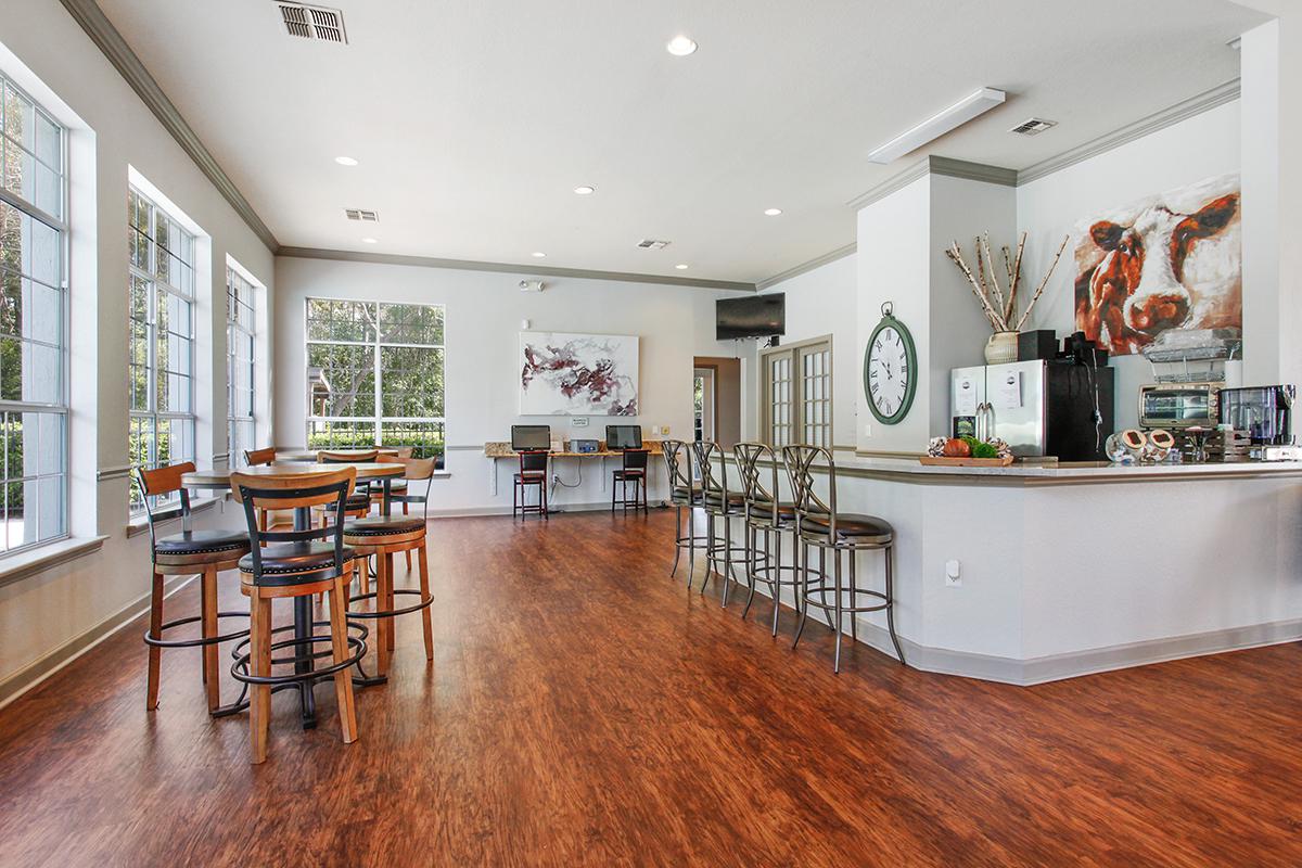 a living room filled with furniture and a large window