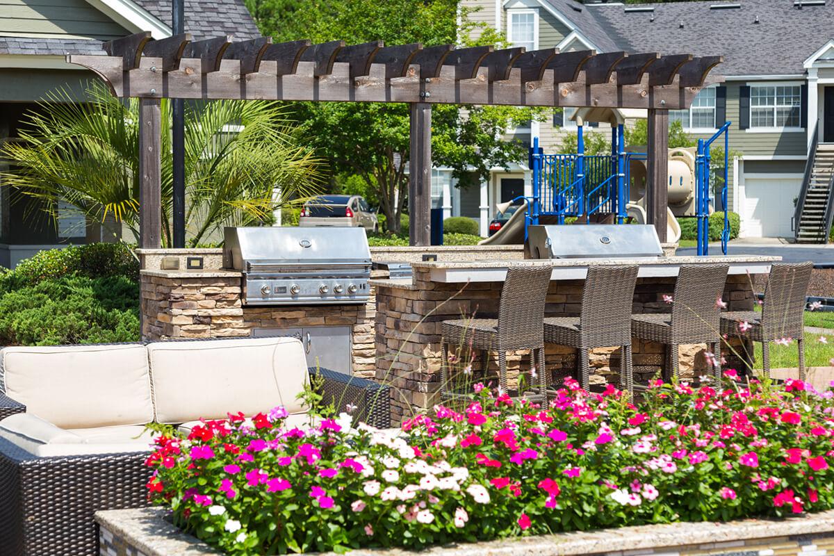 a close up of a flower garden in front of a building