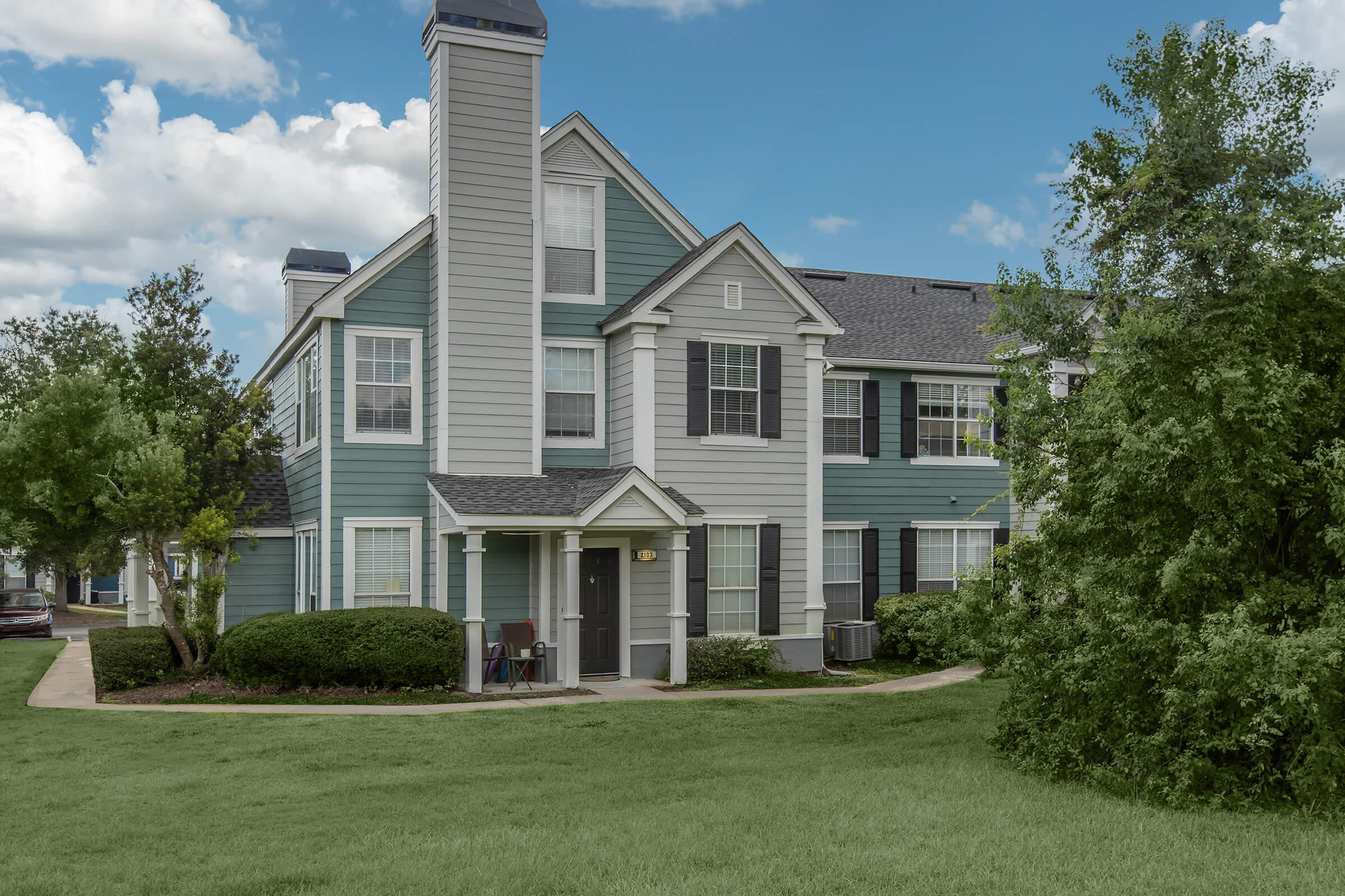 a large lawn in front of a house