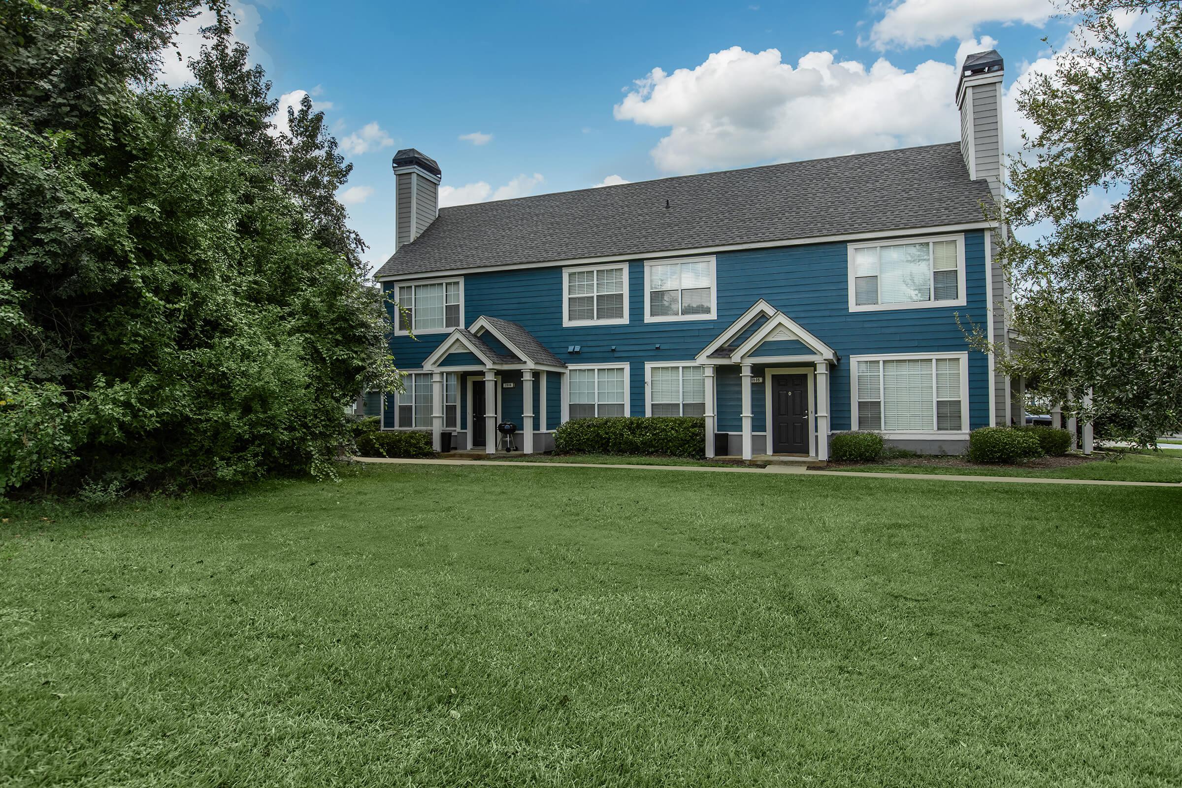 a large lawn in front of a house