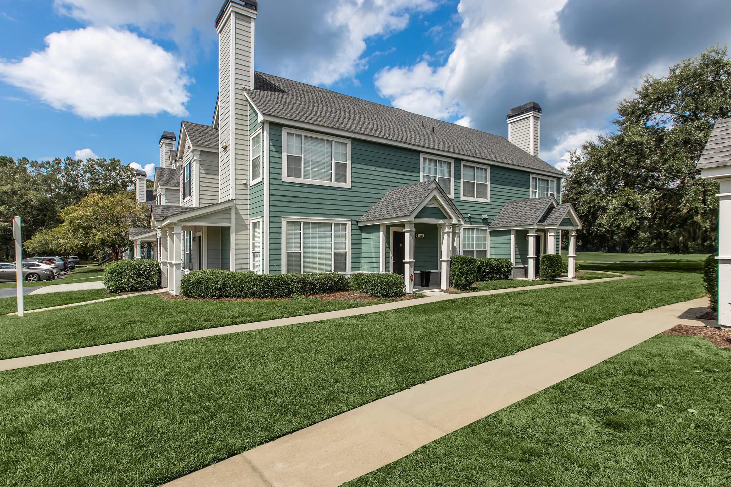 a large lawn in front of a house