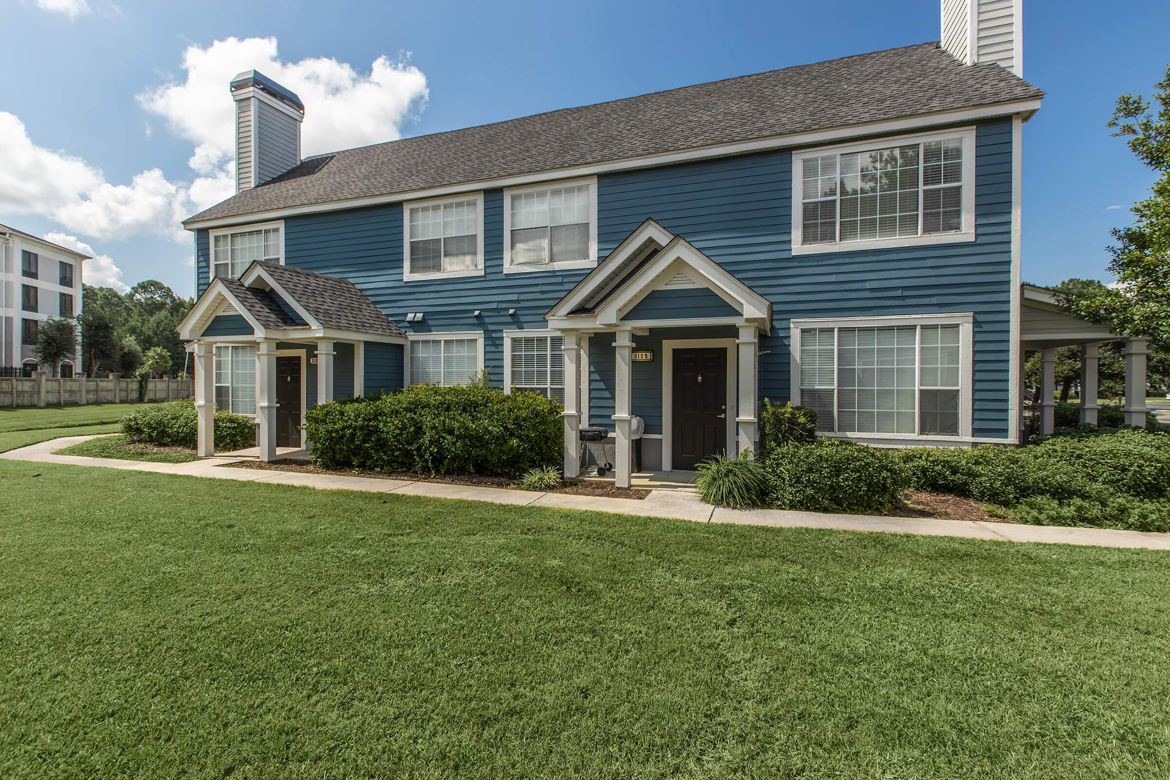 a large lawn in front of a house