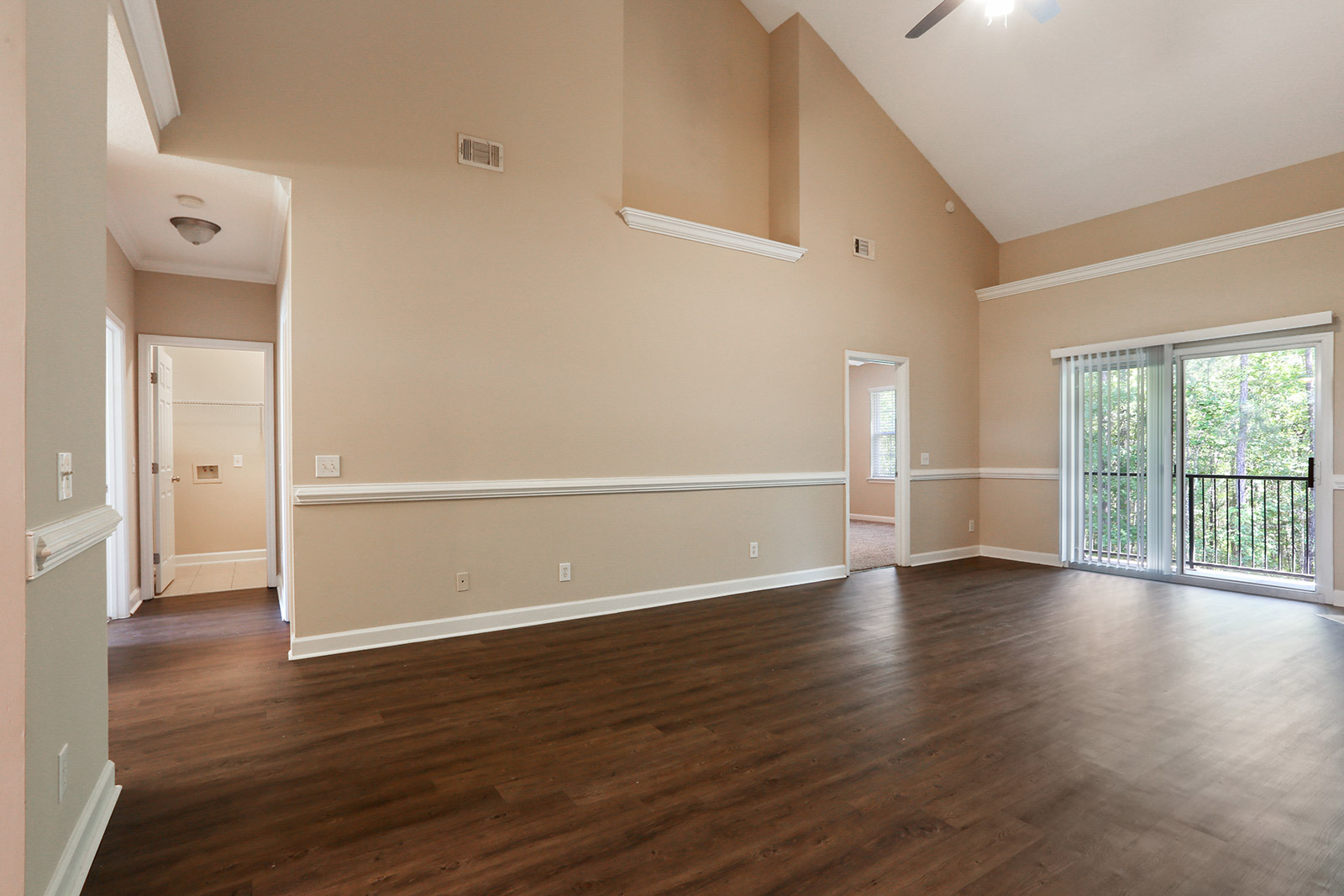 a large empty room with a wood floor