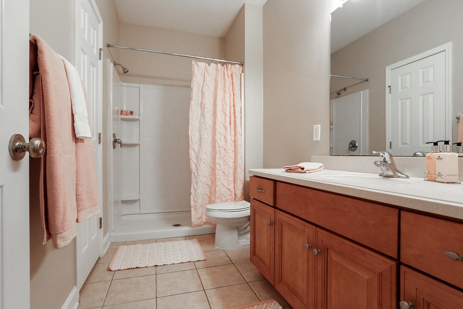 a kitchen with a sink and a mirror