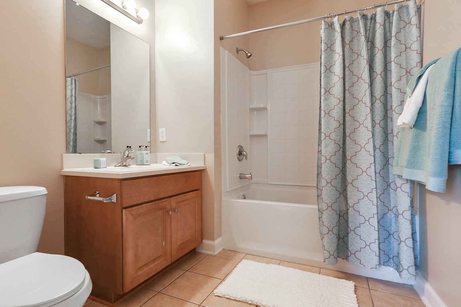 a large white tub sitting next to a shower