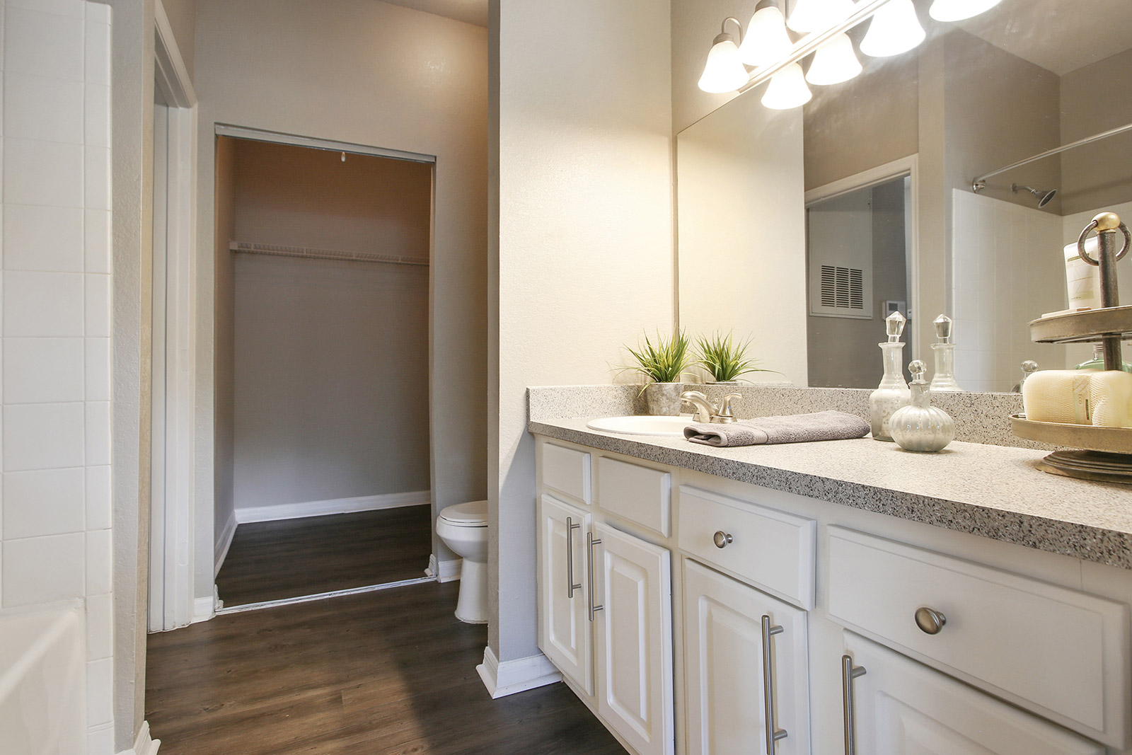 a kitchen with a sink and a mirror