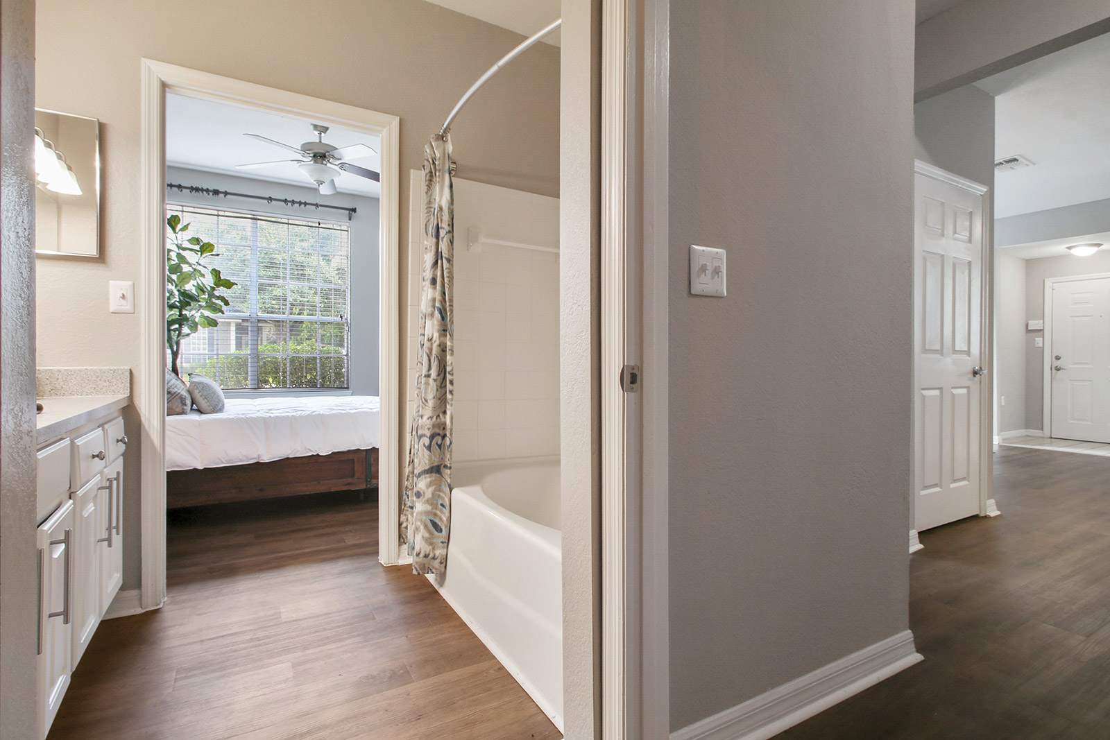 a large white tub next to a window