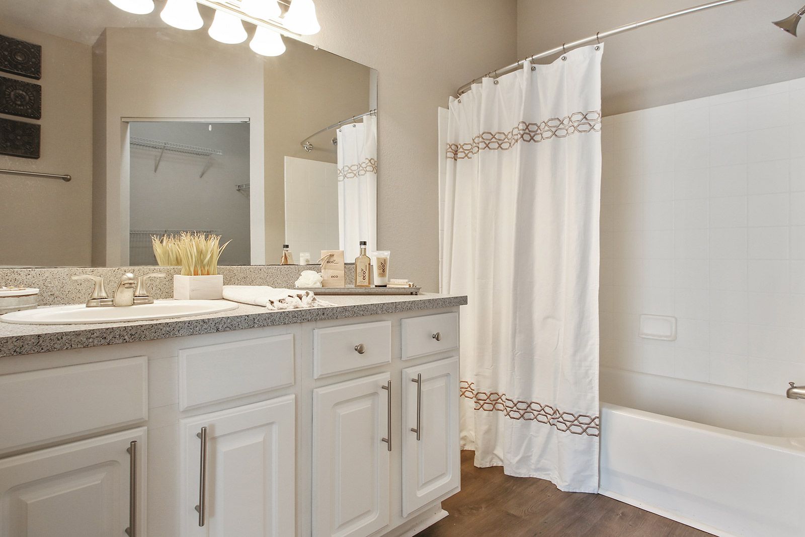 a kitchen with a sink and a mirror