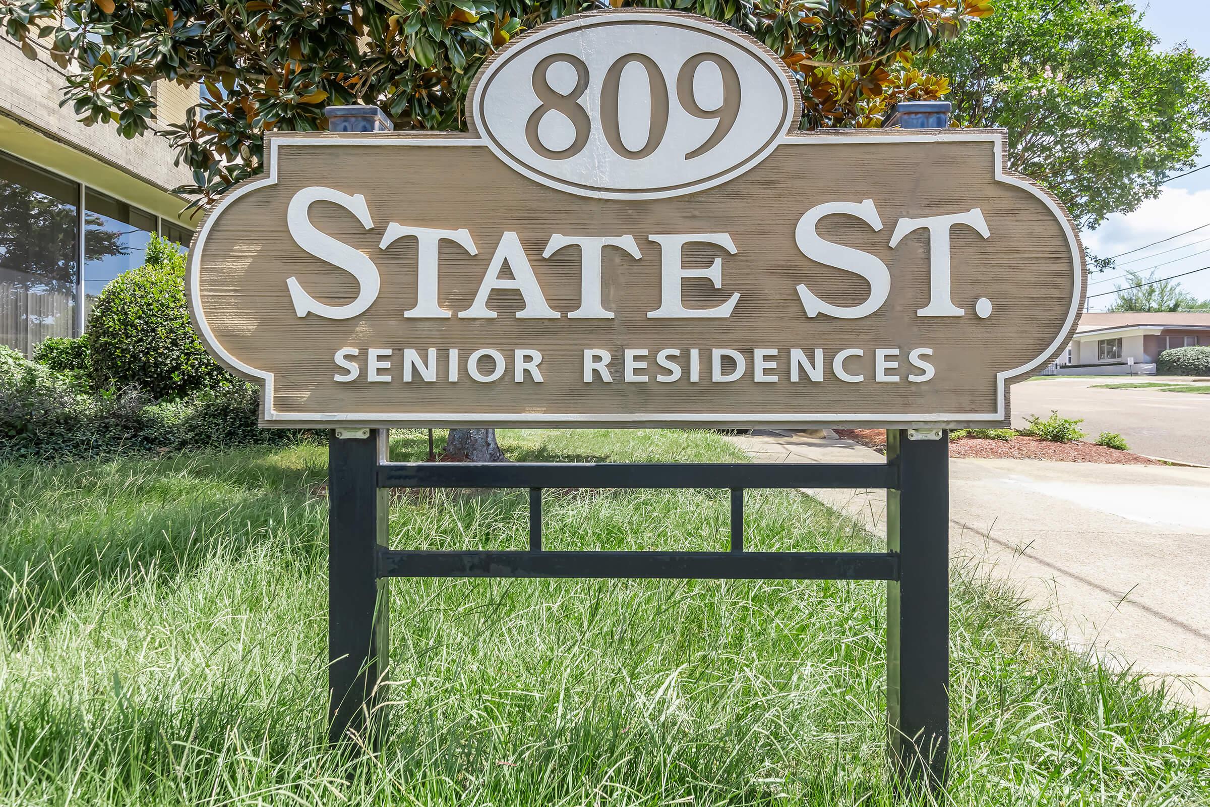 a sign on the grass