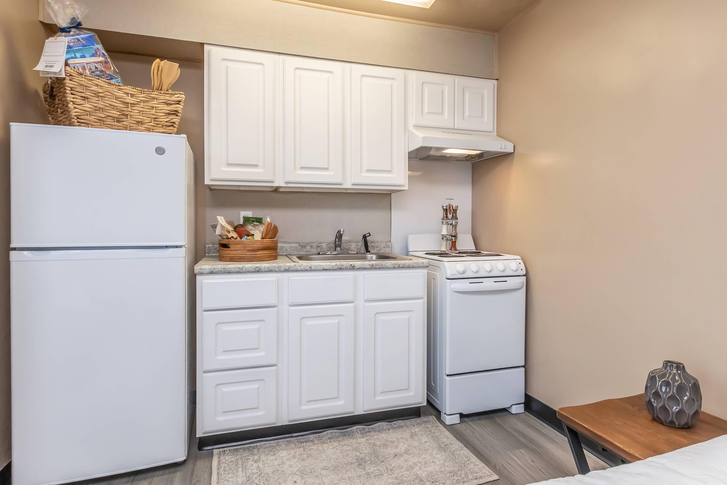 a kitchen with a sink and a refrigerator