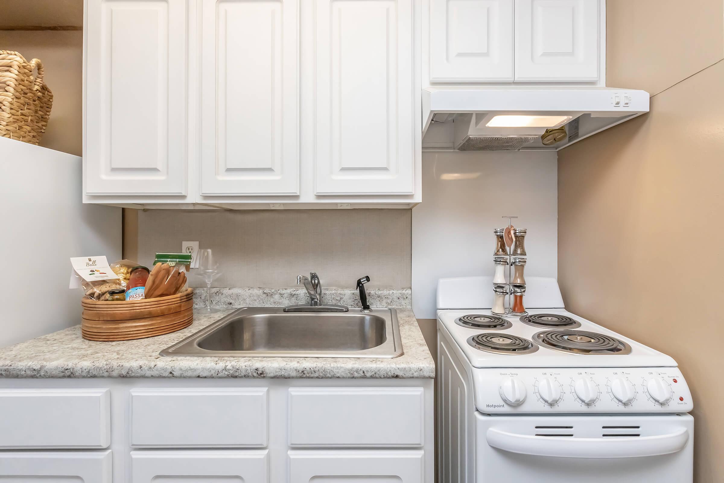 a kitchen with a sink and a microwave