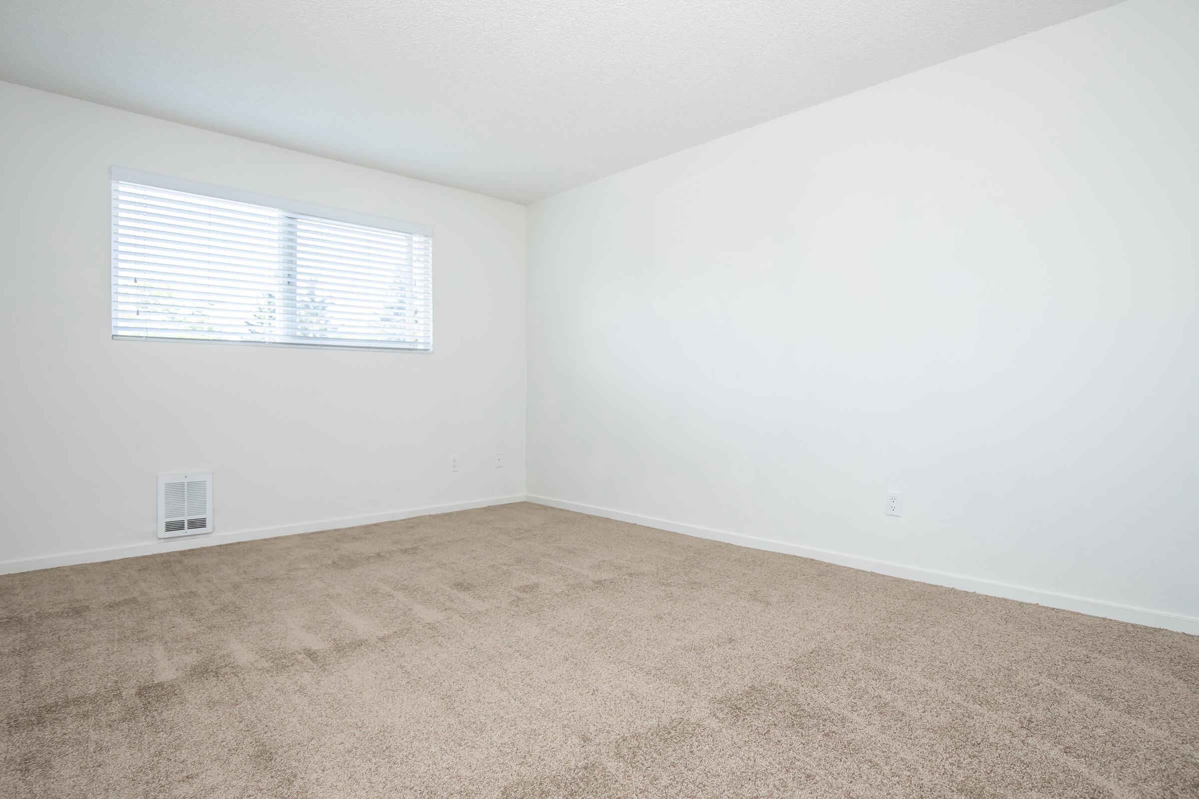 a bedroom with a bed in a room