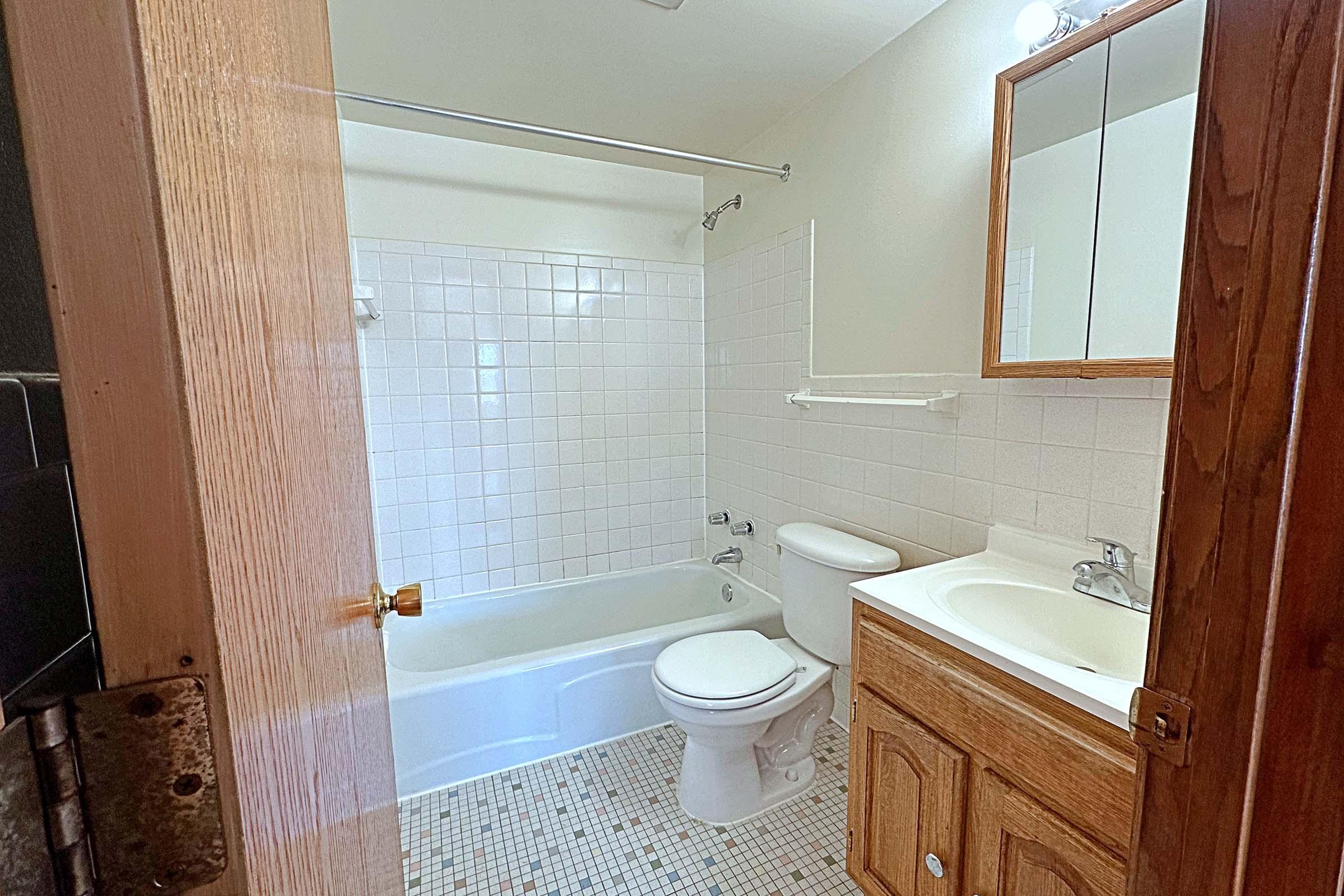 a room with a sink and a shower