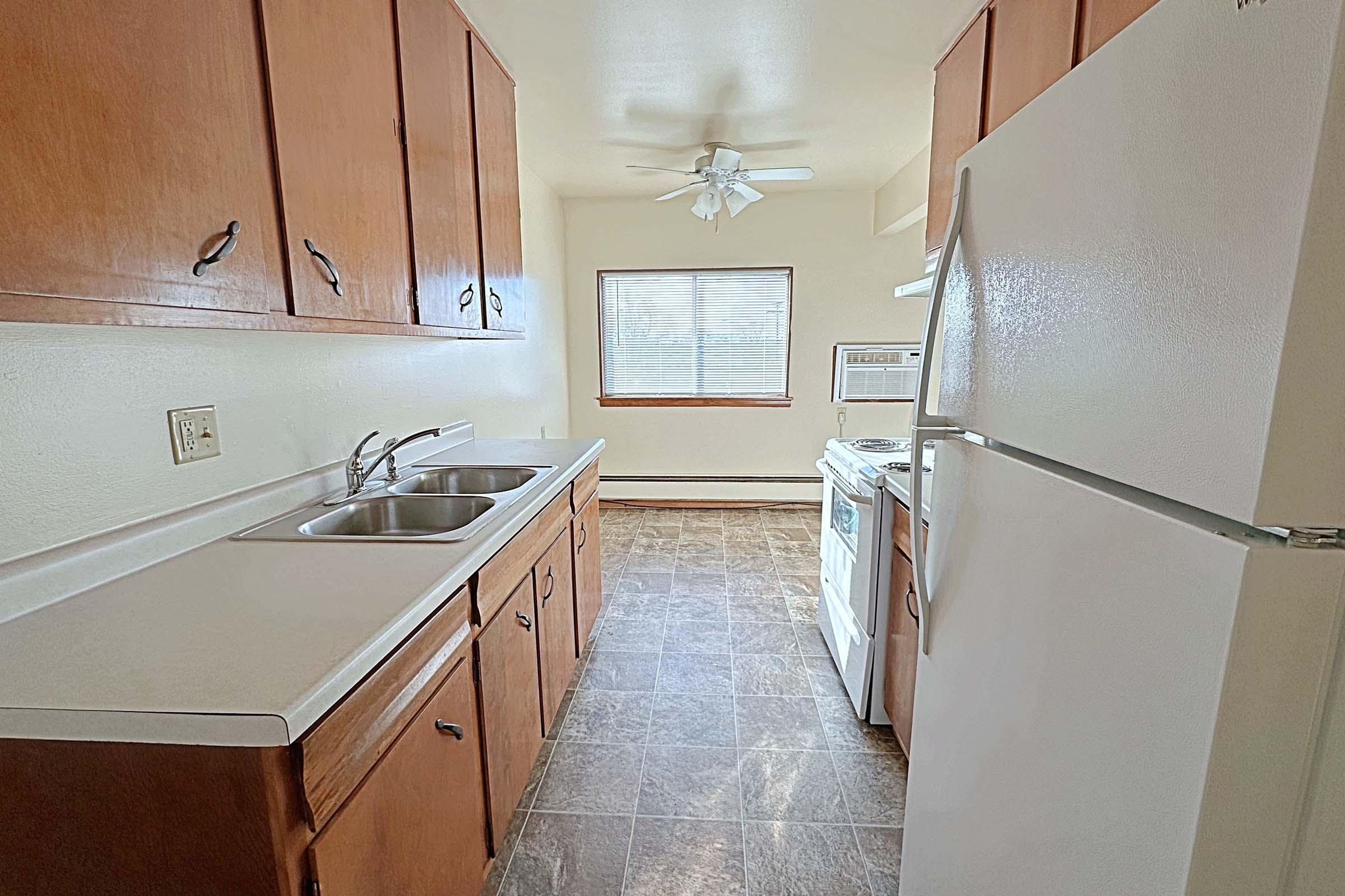 a kitchen with a stove top oven sitting inside of a building