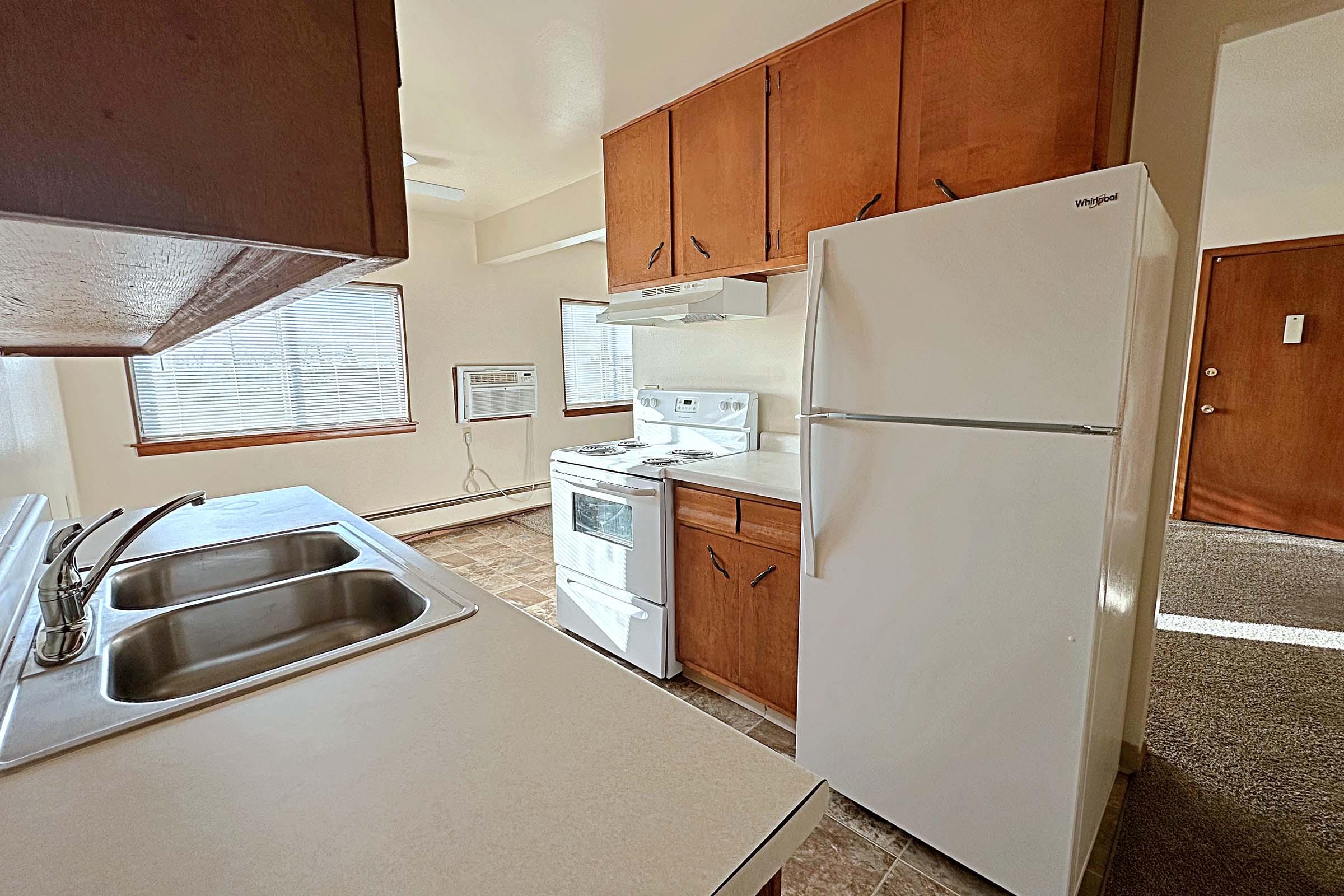 a kitchen with a stove top oven sitting inside of a refrigerator