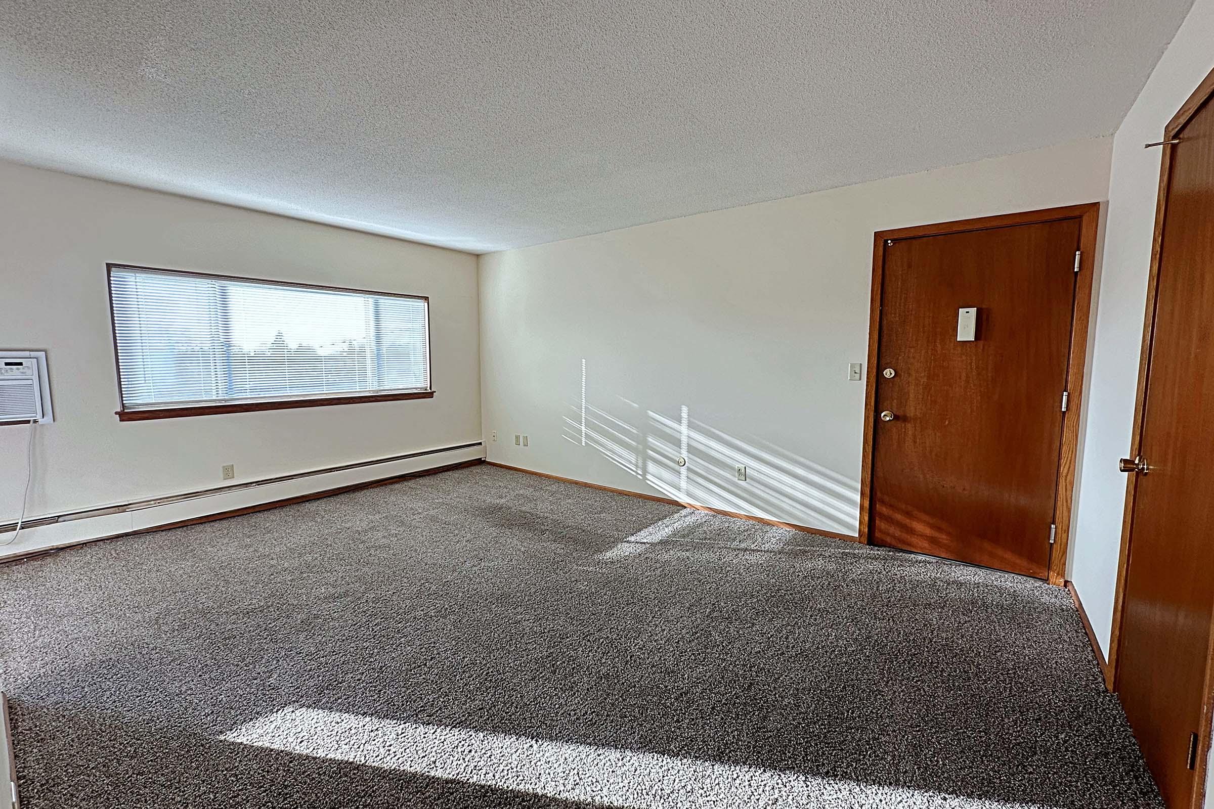 a bedroom with a large window