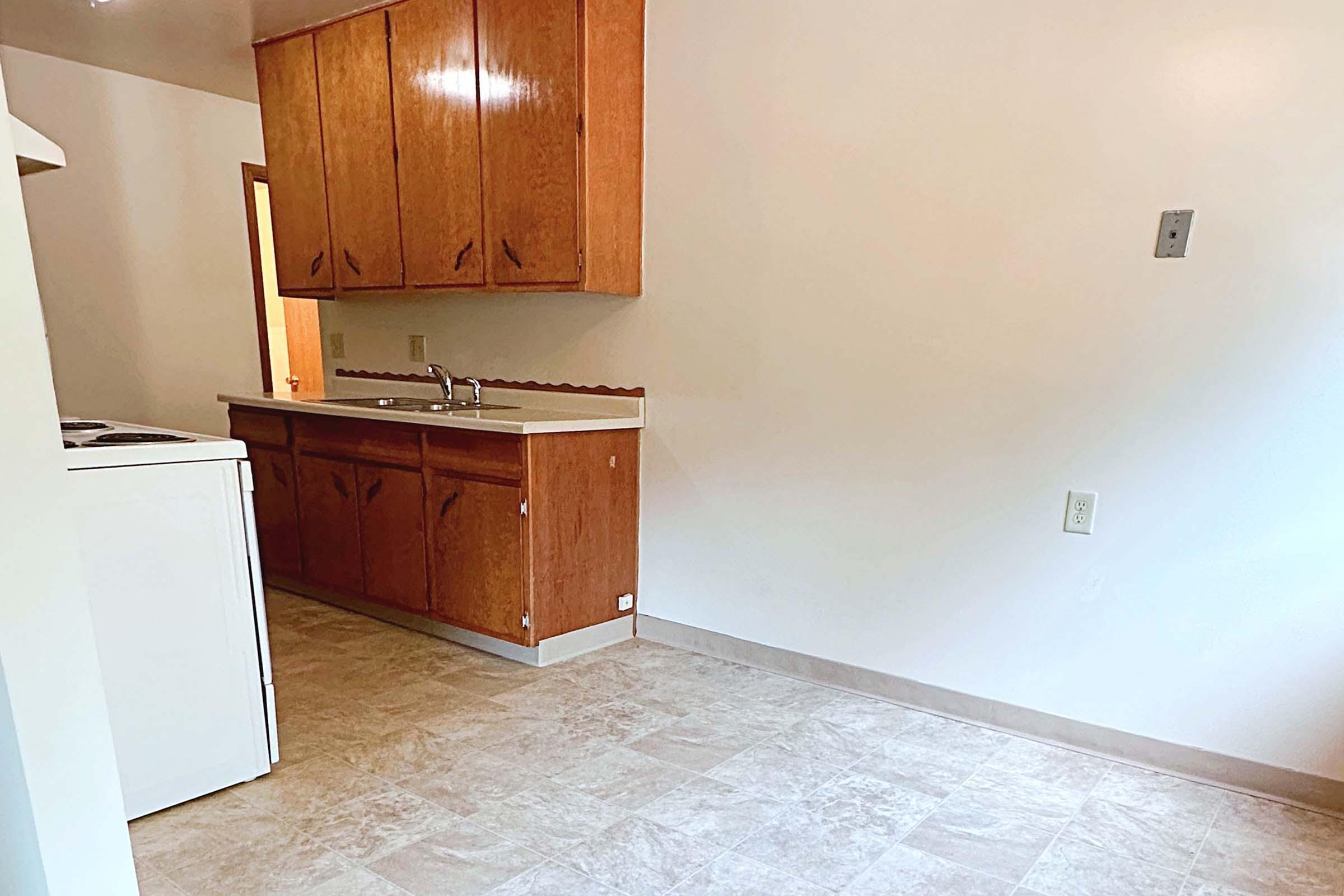 a kitchen with a stove and a refrigerator